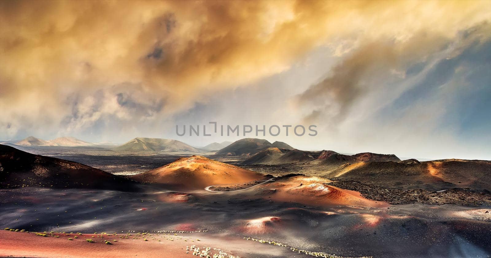 beautiful mountain landscape with volcanoes in at sunset Timanfaya National Park in Lanzarote, Canary Islands