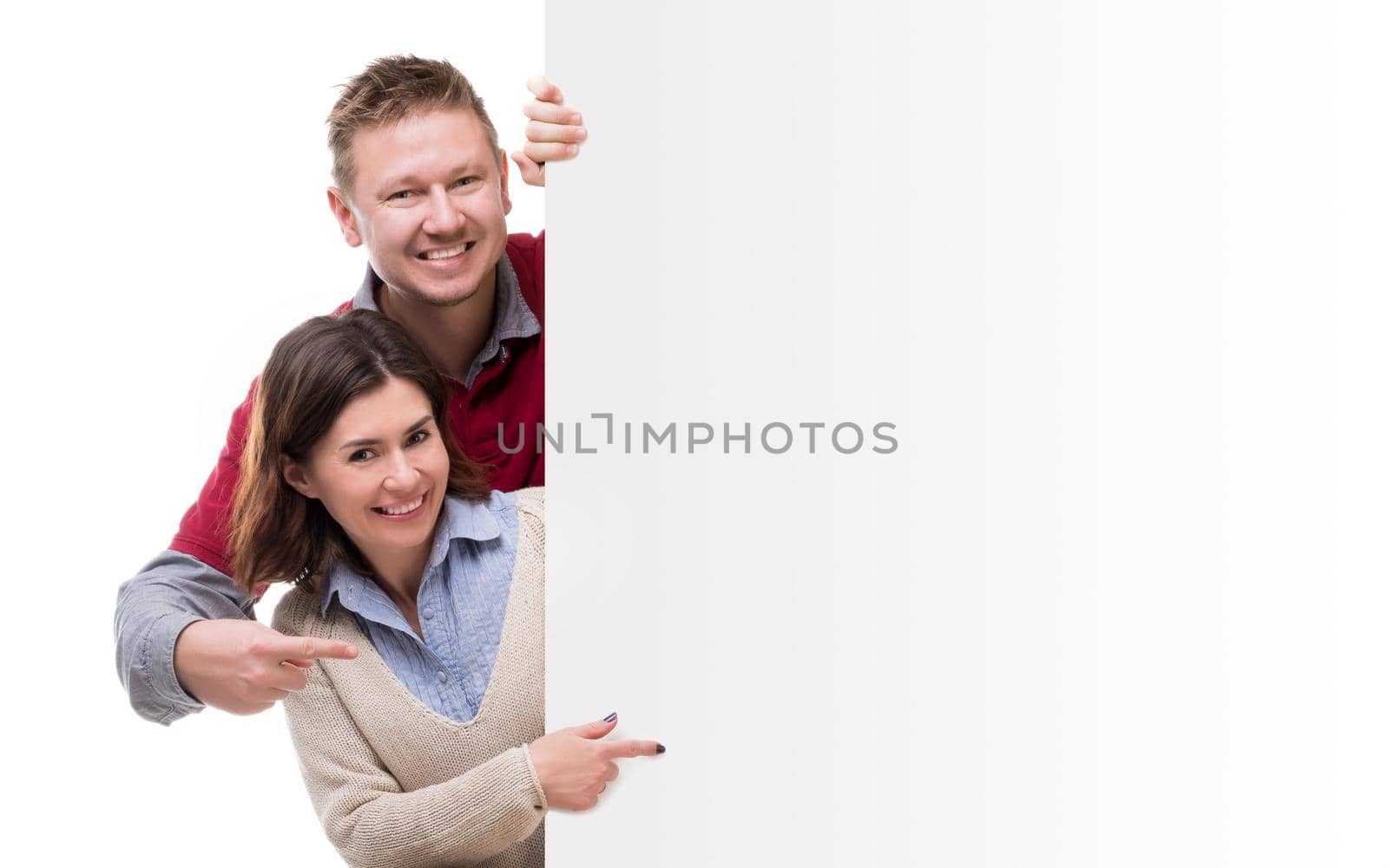 man adm woman pointing at empty blank for advertisement isolated on white background