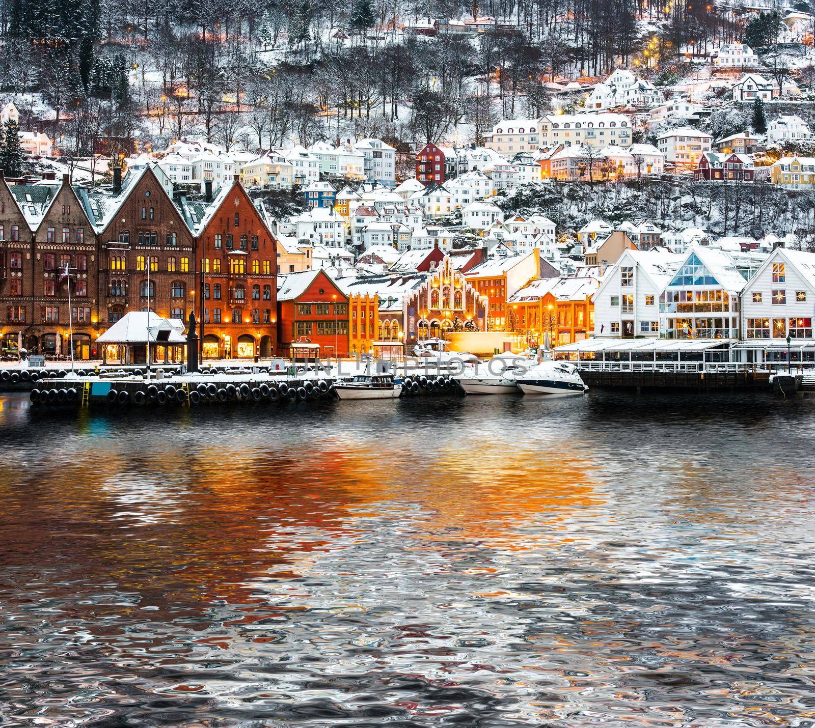 Bryggen street with wooden houses with reflection in Bergen at Christmas, Norway