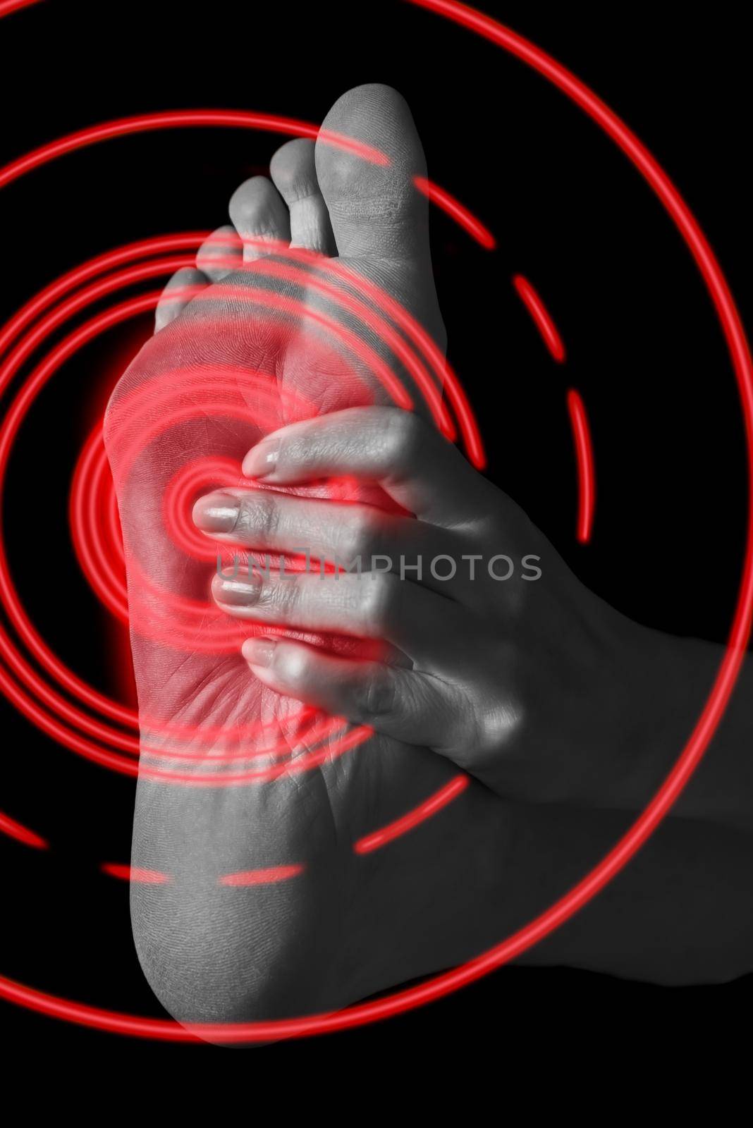 Pain in the female foot, monochrome image, pain area of red color