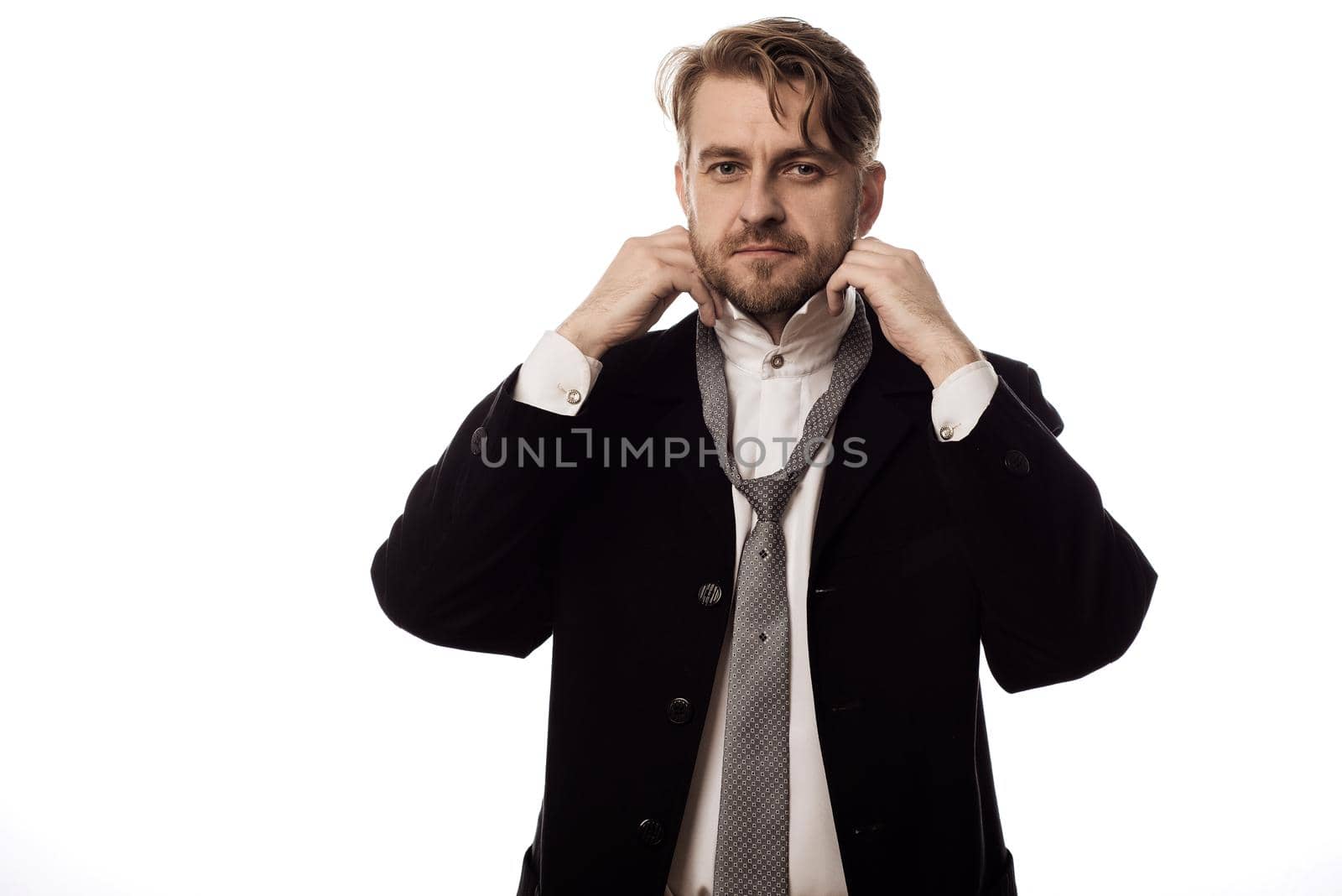 young stylish businessman dresses at work isolated on white