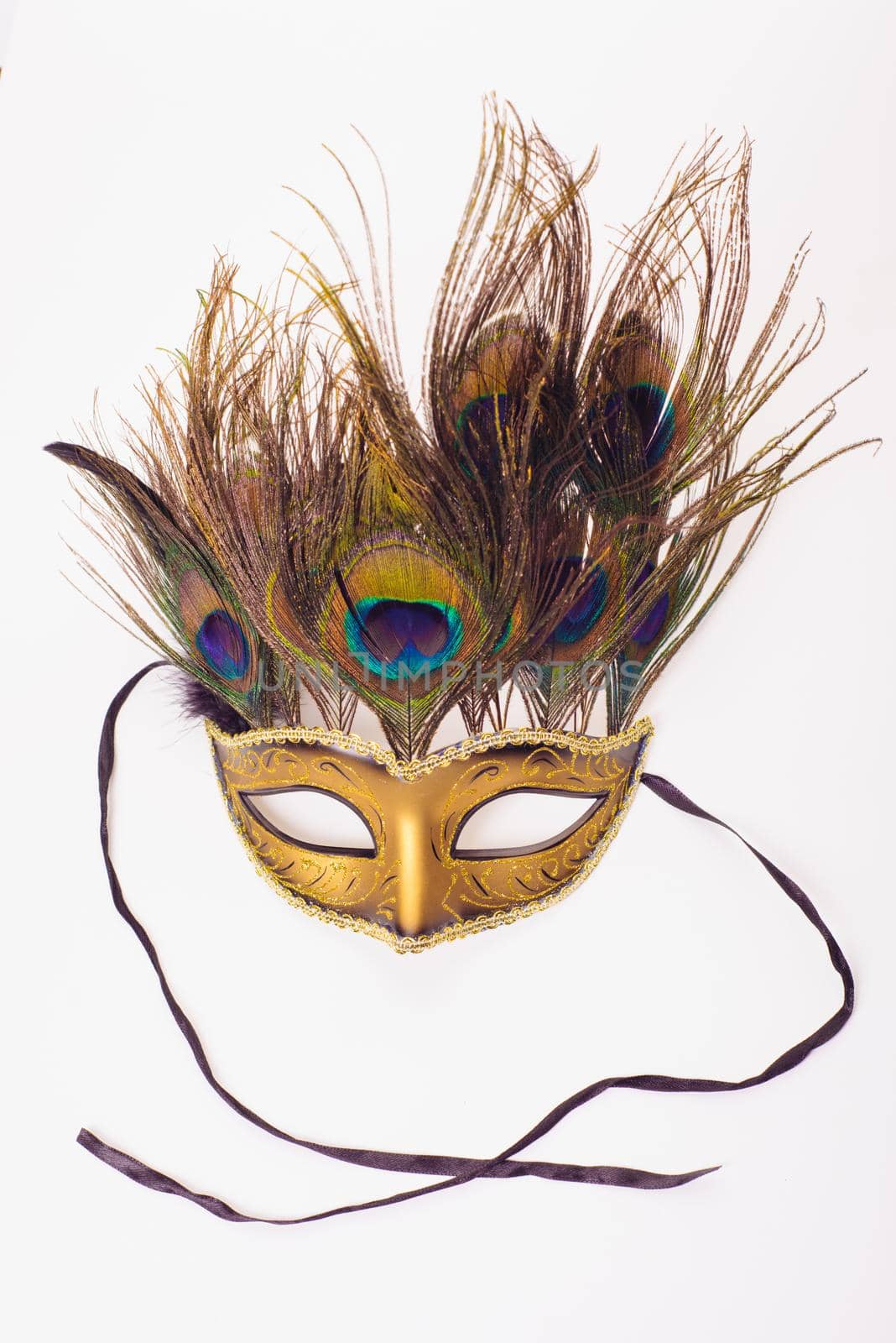 carnival venetian mask with peacock feathers isolated over white with clipping path.