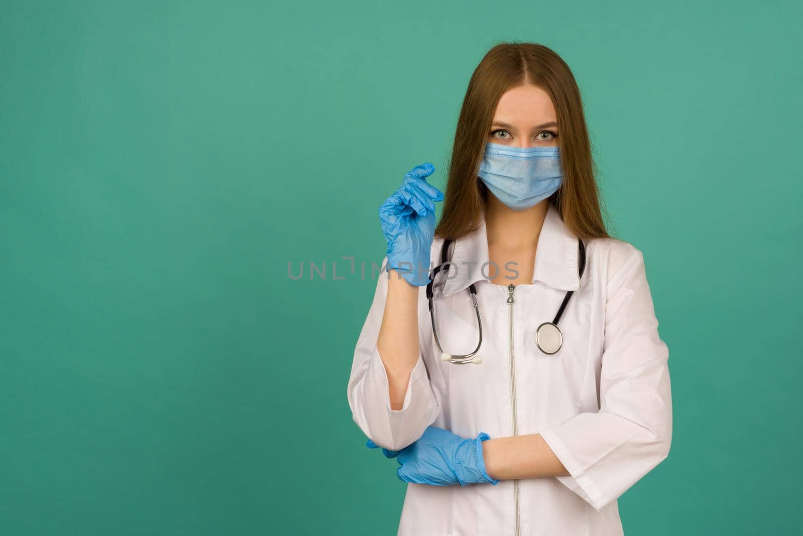Covid19, coronavirus, healthcare and doctors concept. Portrait of professional confident young caucasian doctor in medical mask and white coat, stethoscope over neck, ready help patient, fight disease - image