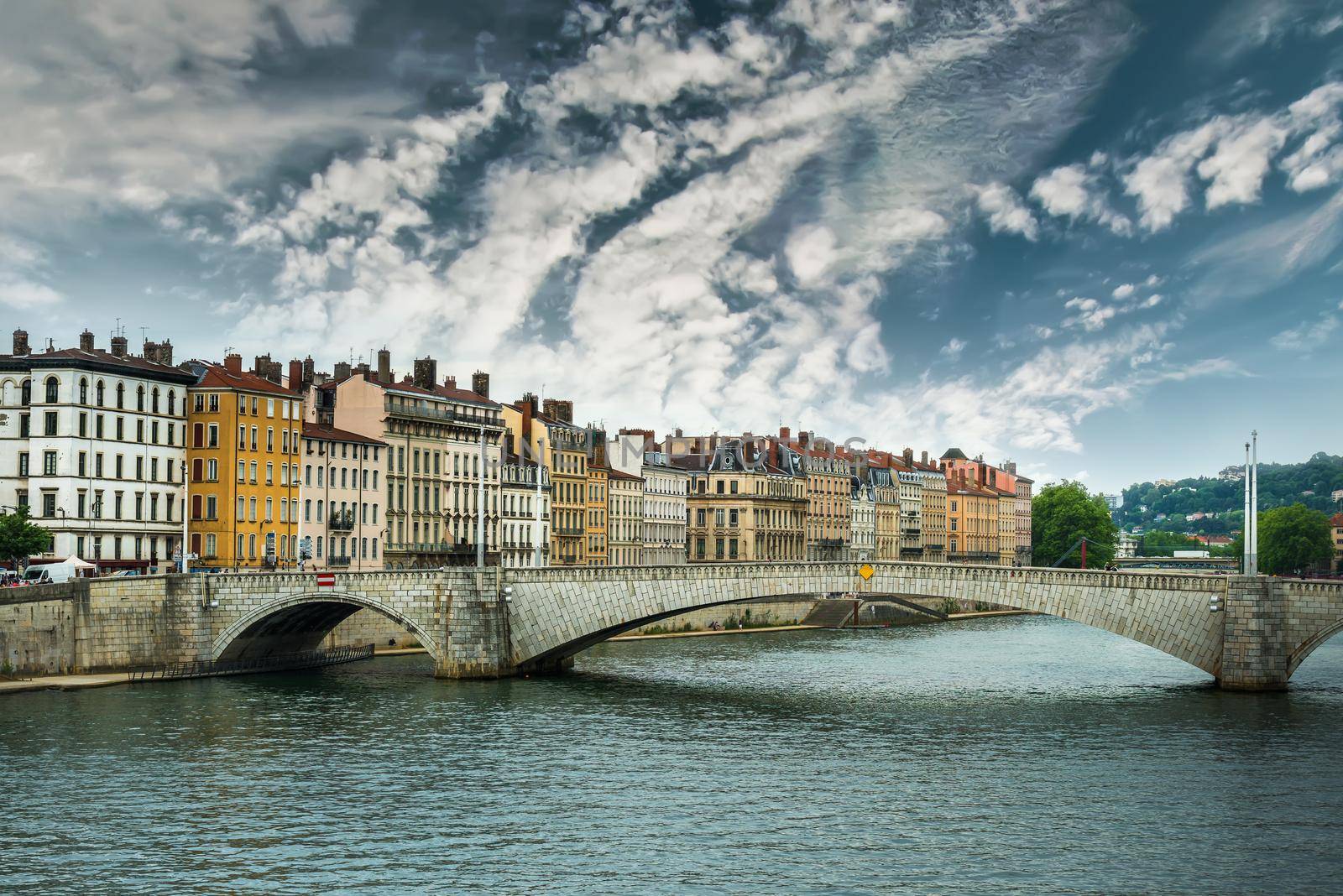 view from river Sona to the Bonaparte bridge and Lyon city against sky, France