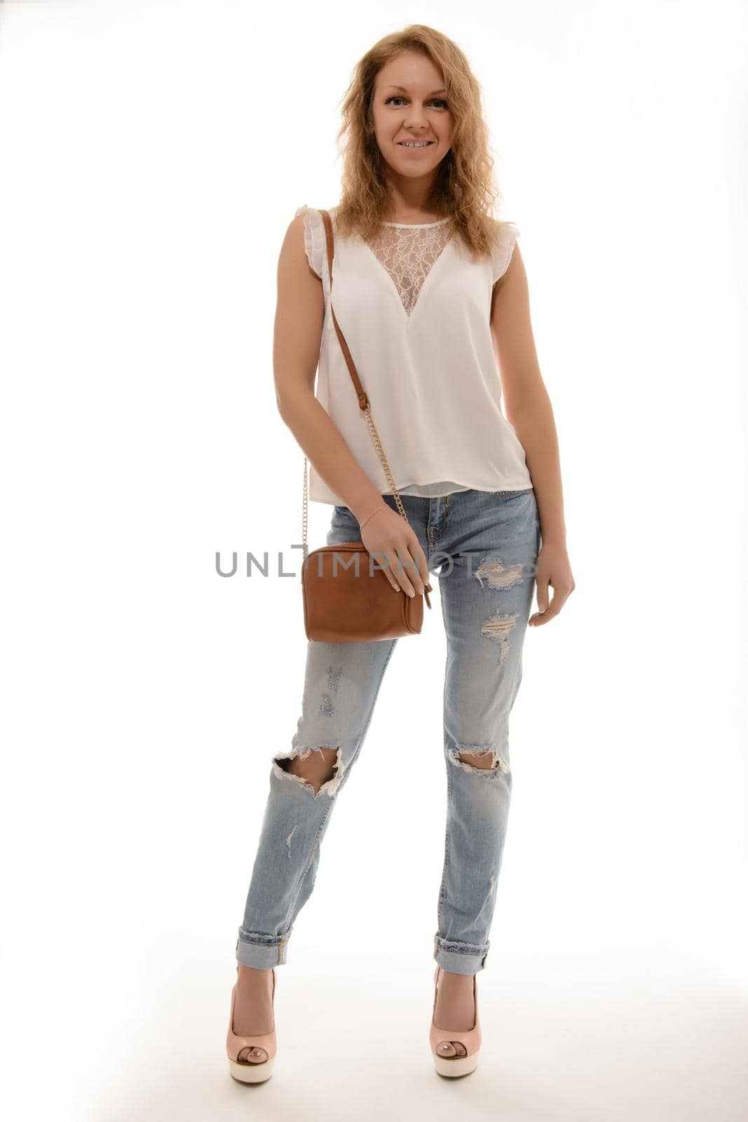 Beautiful happy woman holding a bag