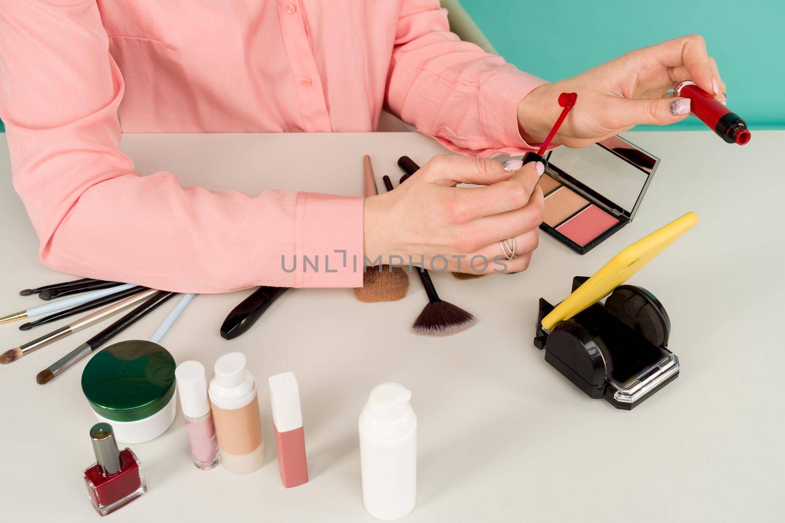 Beauty blogger producing makeup tutorial online translation - image