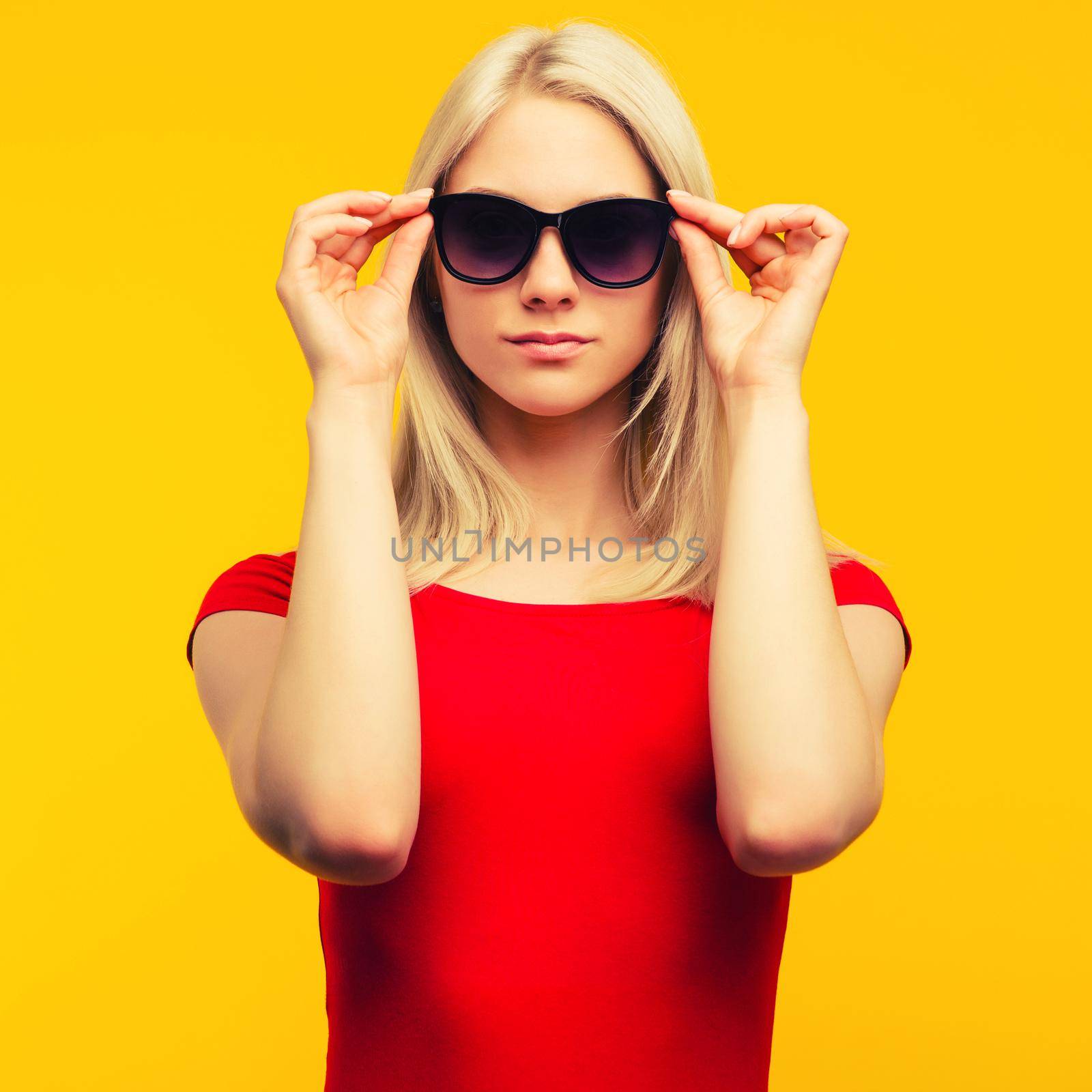 pretty blond lifeguard in red swimsuit and sunglasses by zartarn