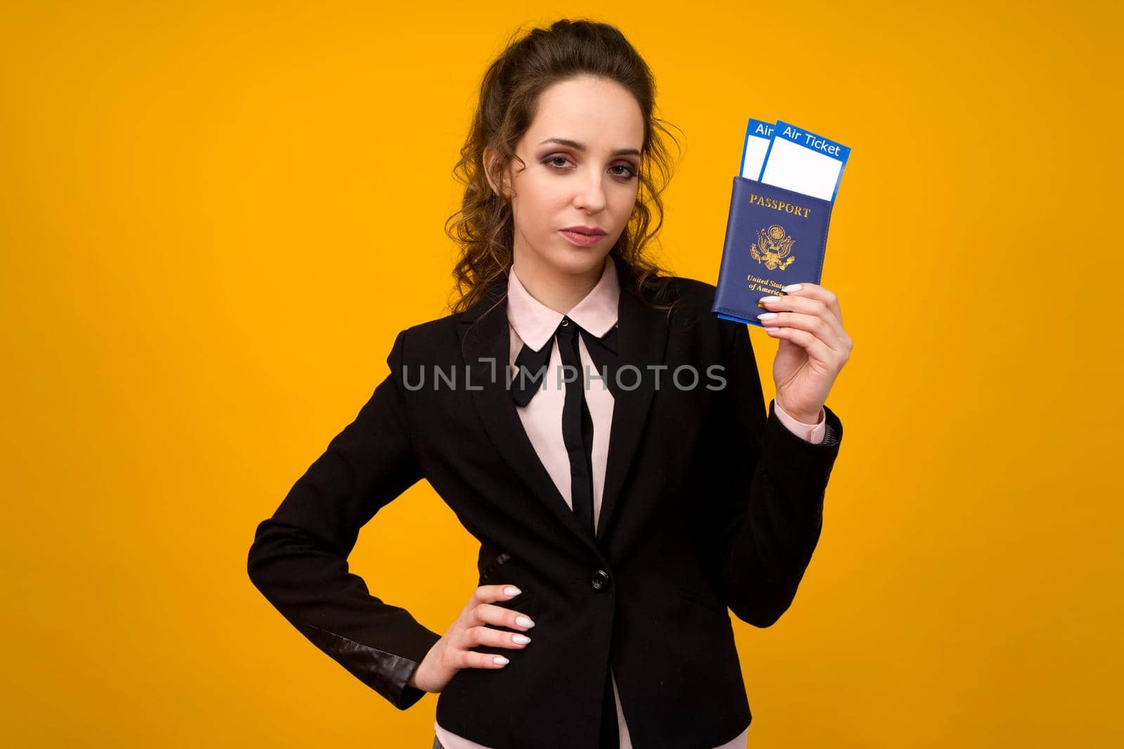 Business Woman Holding Tickets And Passport On Yellow Studio Background - image