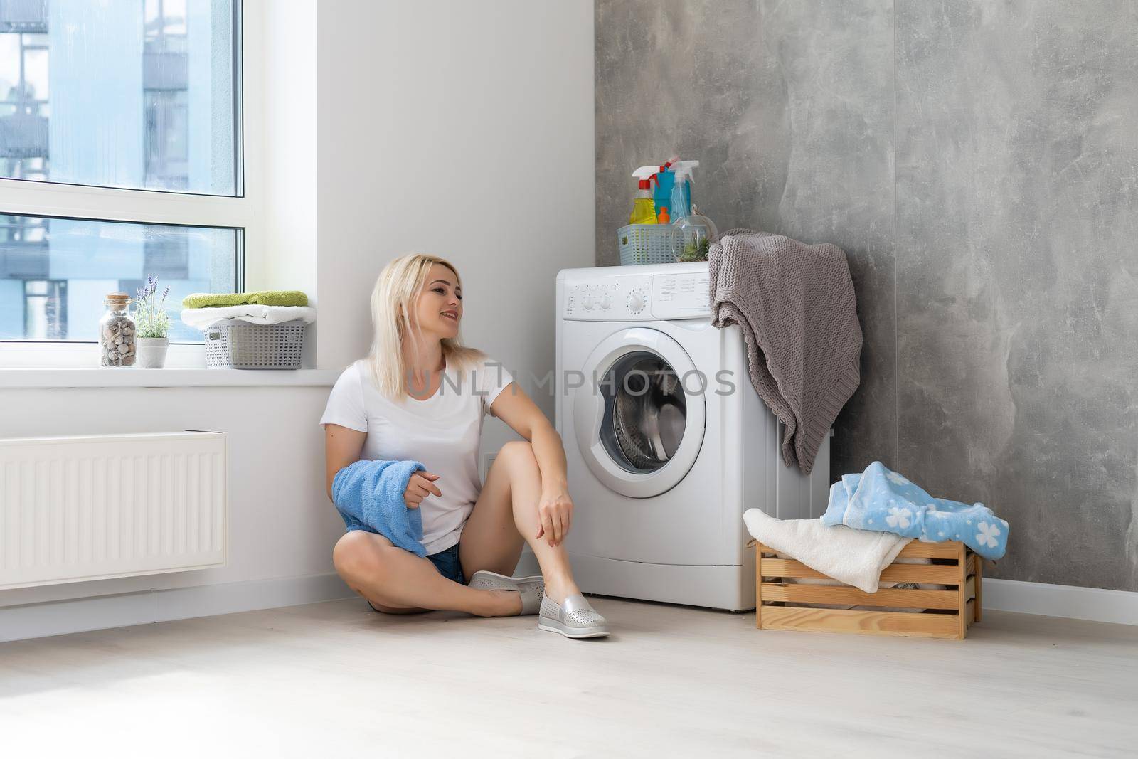 pretty smiling girl in the laundry room
