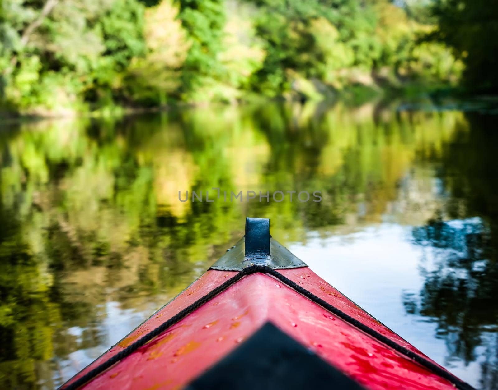 nose of kayak floating on a river