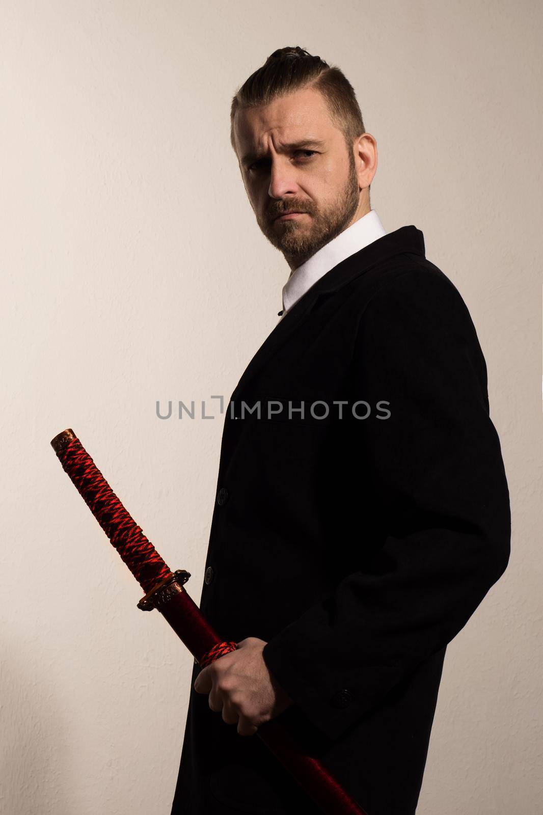 businessman in a black suit with a samurai sword by zartarn