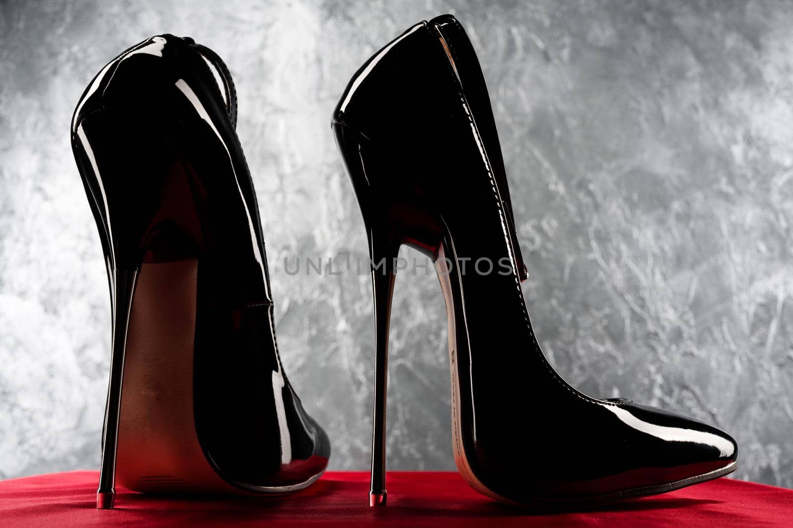Black fetish shiny patent leather stiletto high heels with ankle strap - image
