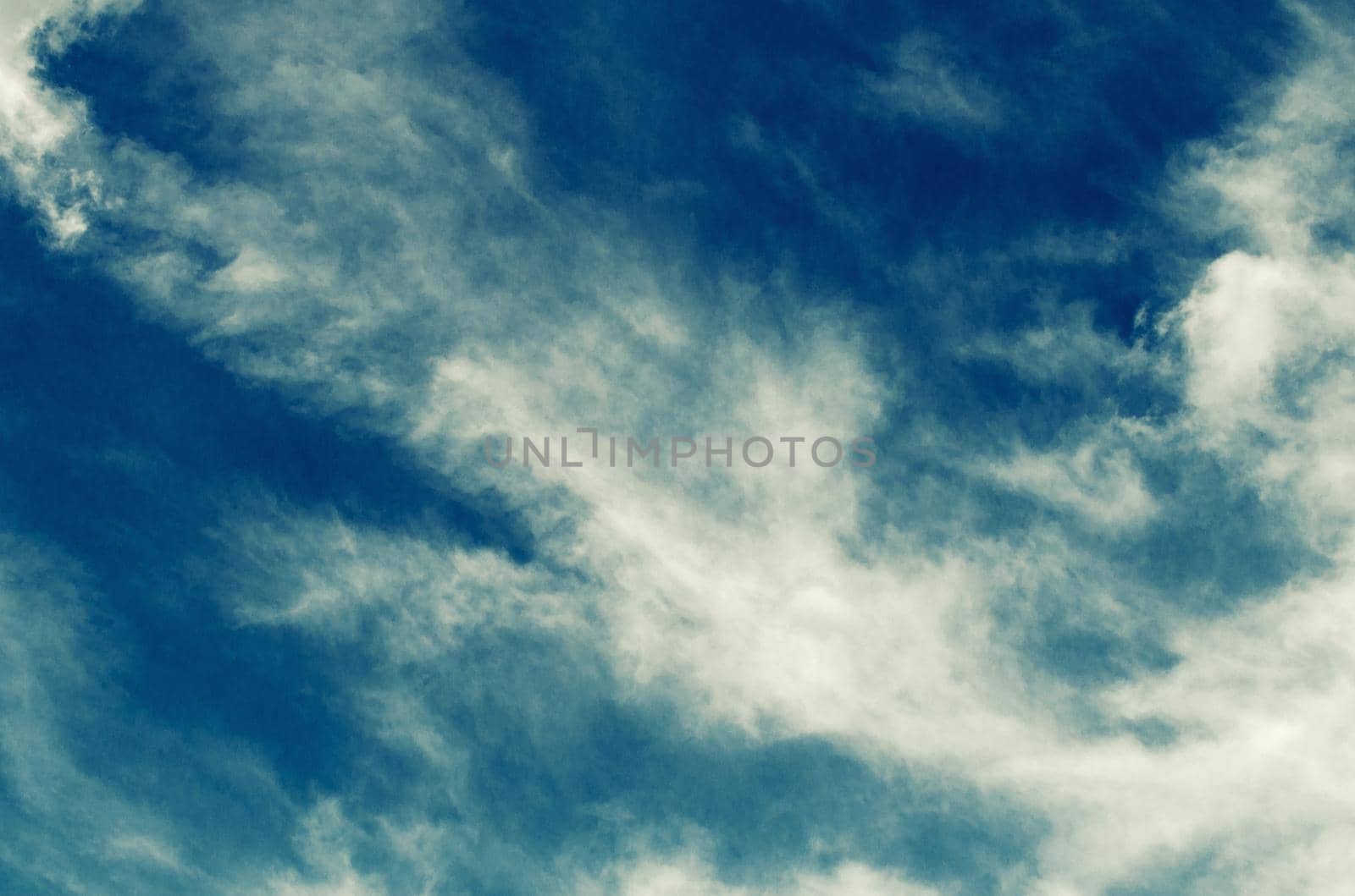 Incredibly wonderful lush cumulus clouds against a blue sky - Image toned