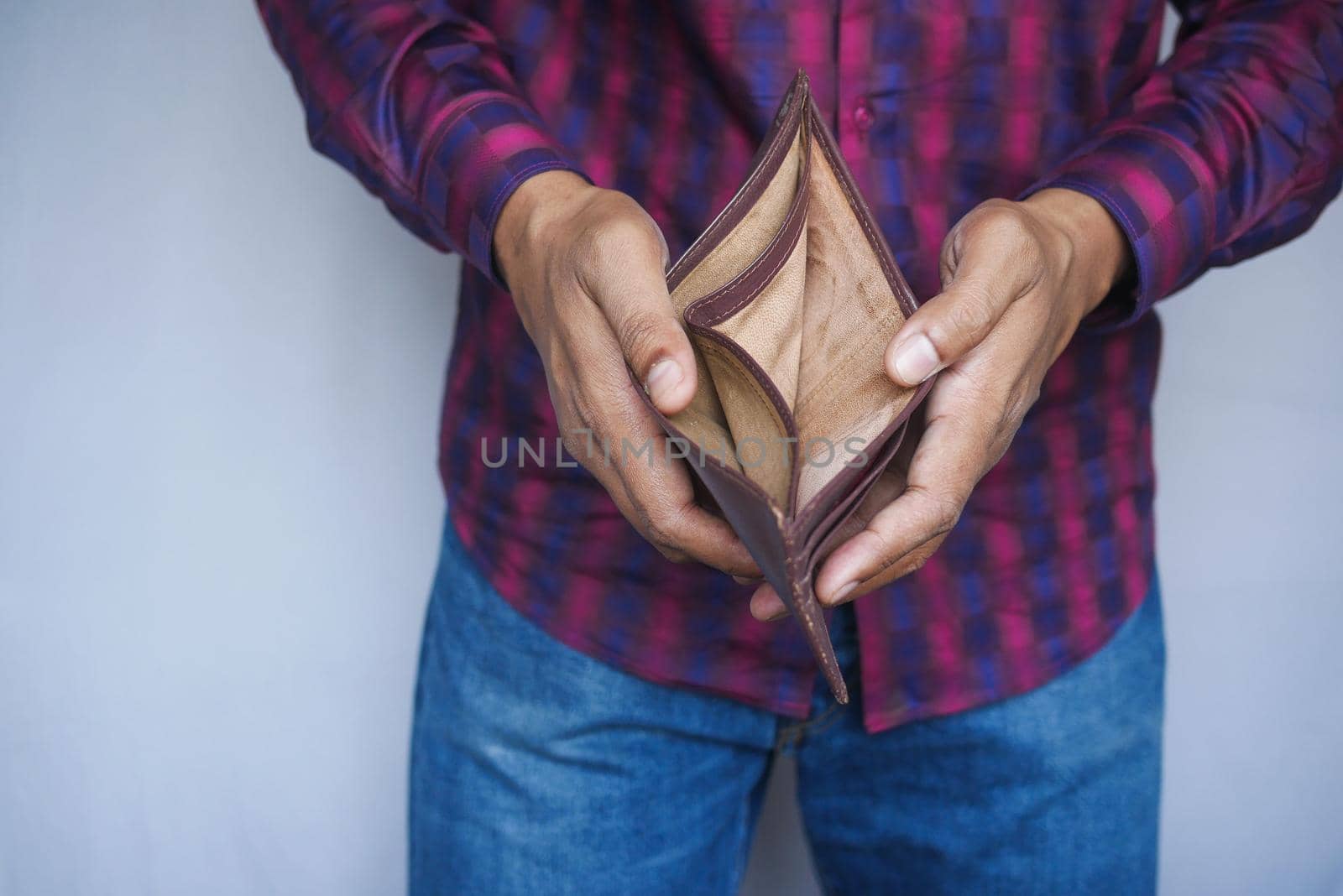 Man hand open an empty wallet with copy space