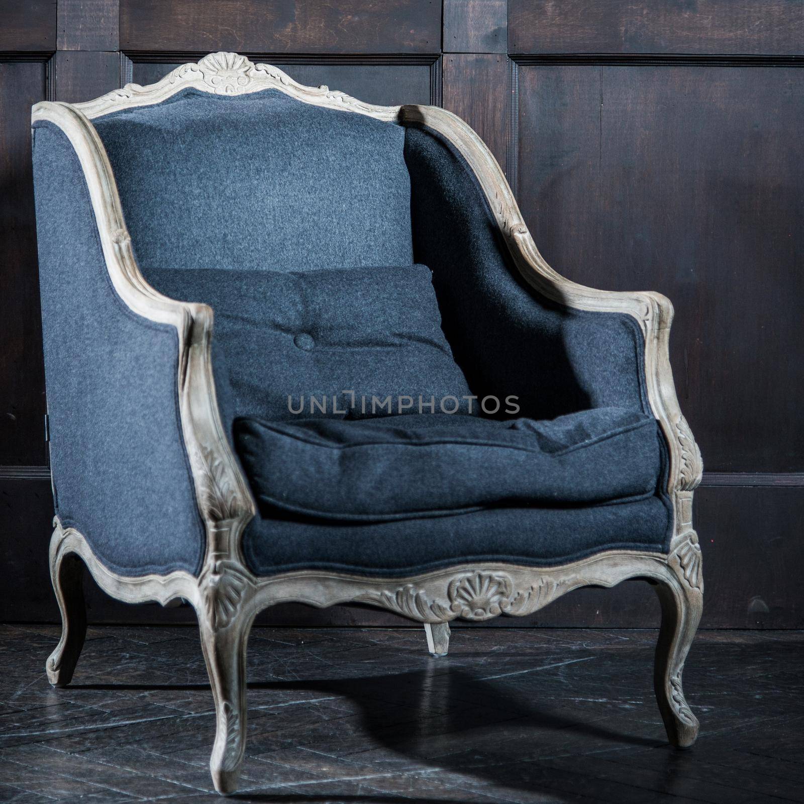 Blue classical style Armchair sofa couch in vintage room.