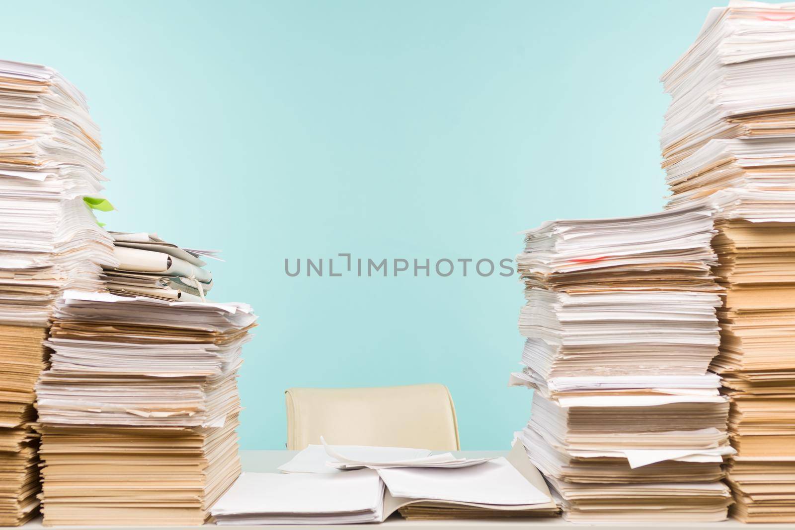 Stack of paper on desktop in office. -image