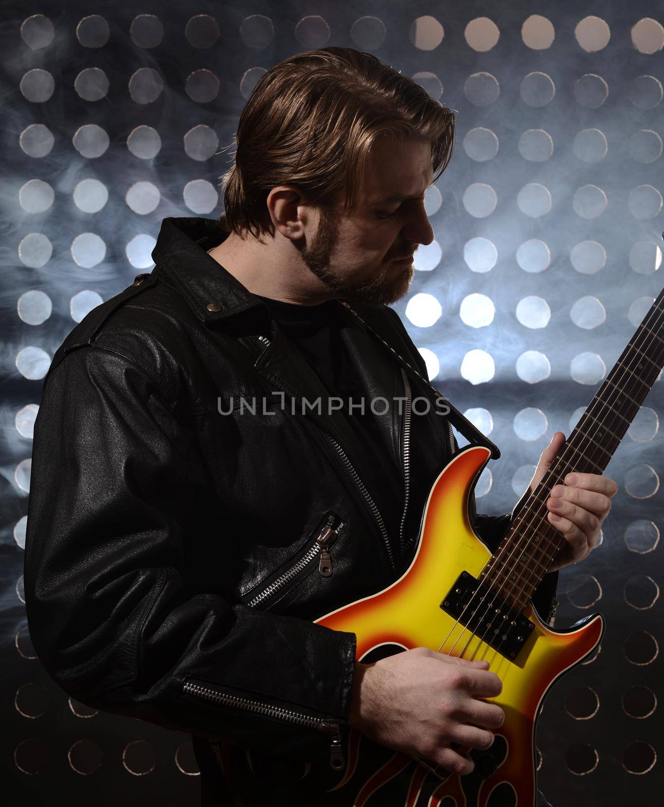 rock guitarist playing electric guitar in fog by zartarn