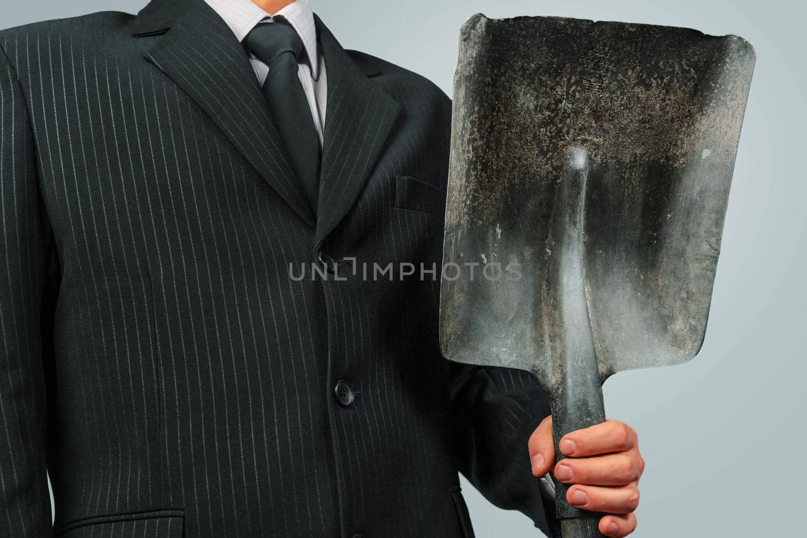 Businessman with shovel by alexAleksei