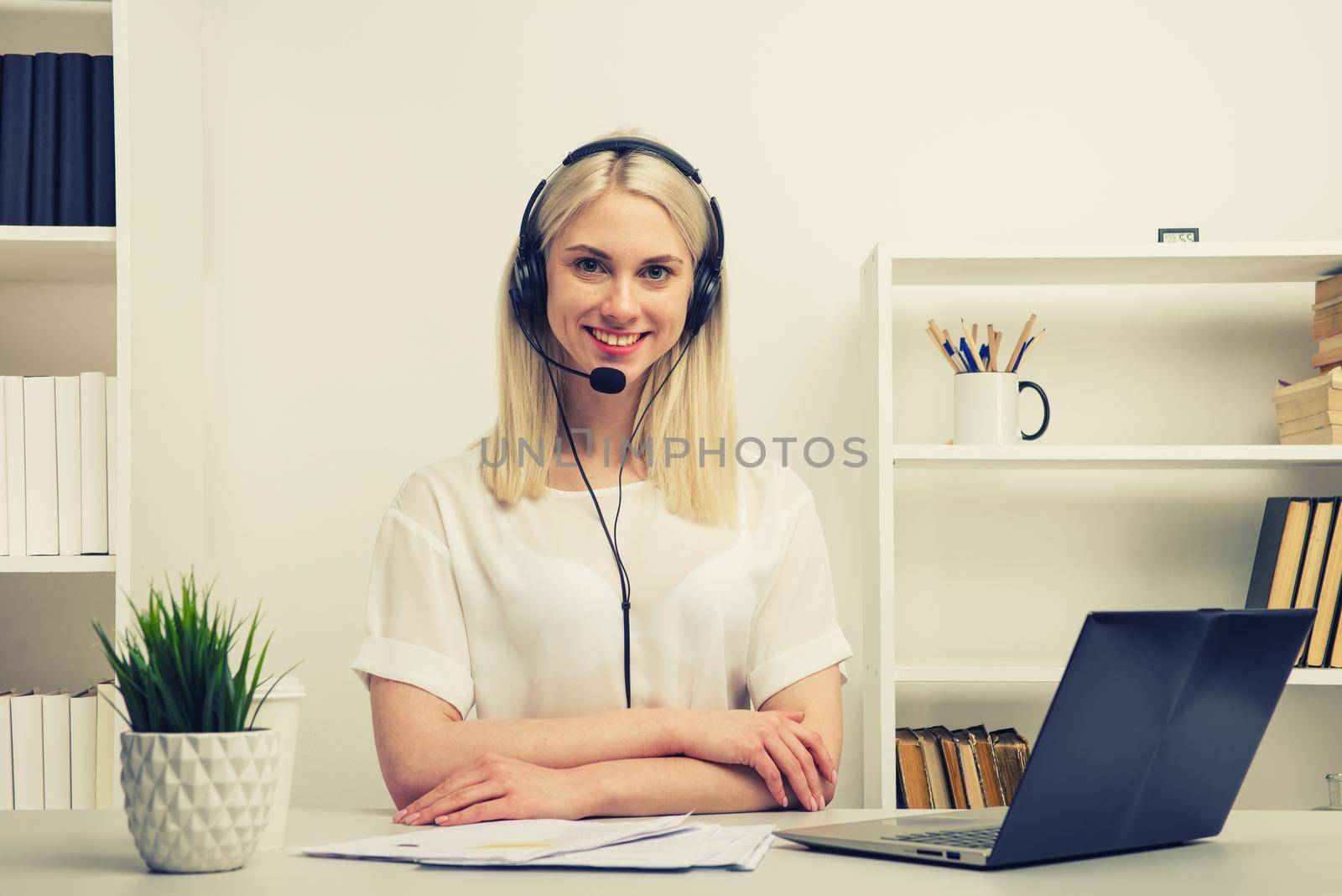 Close-up portrait of a customer service agent sitting at office by zartarn