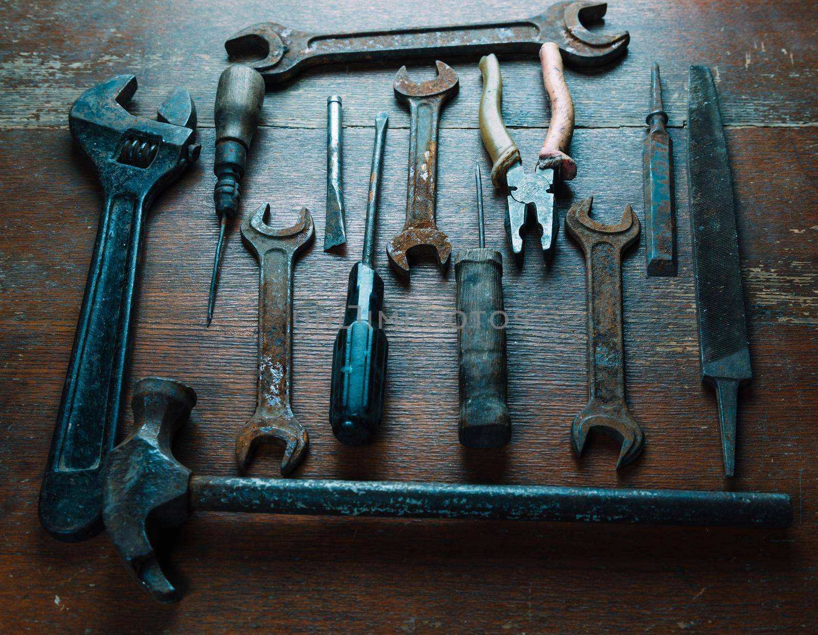 Set of old working tools on wooden surface, no people