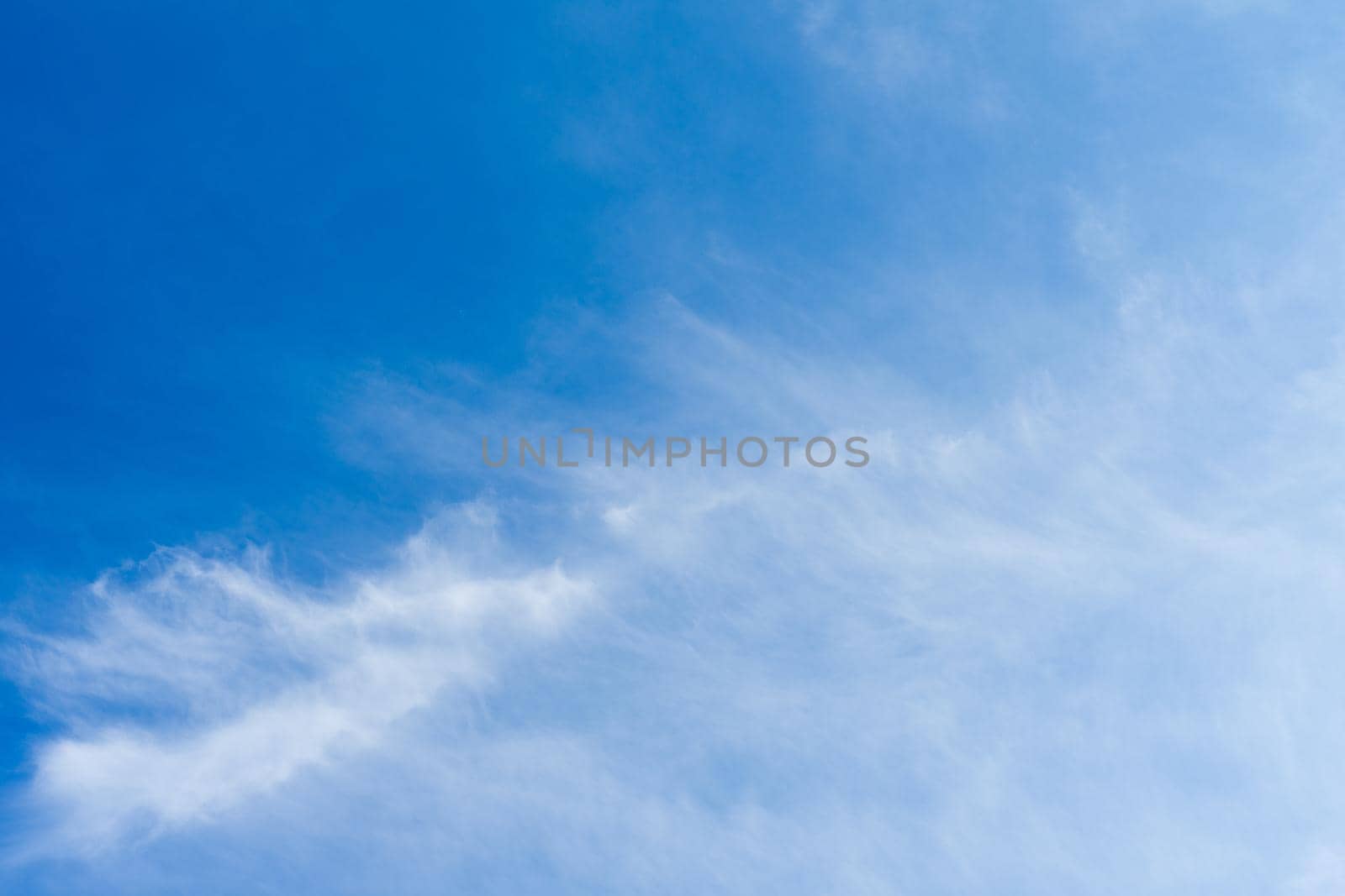 White Spindrift clouds on blue beauty sky - image