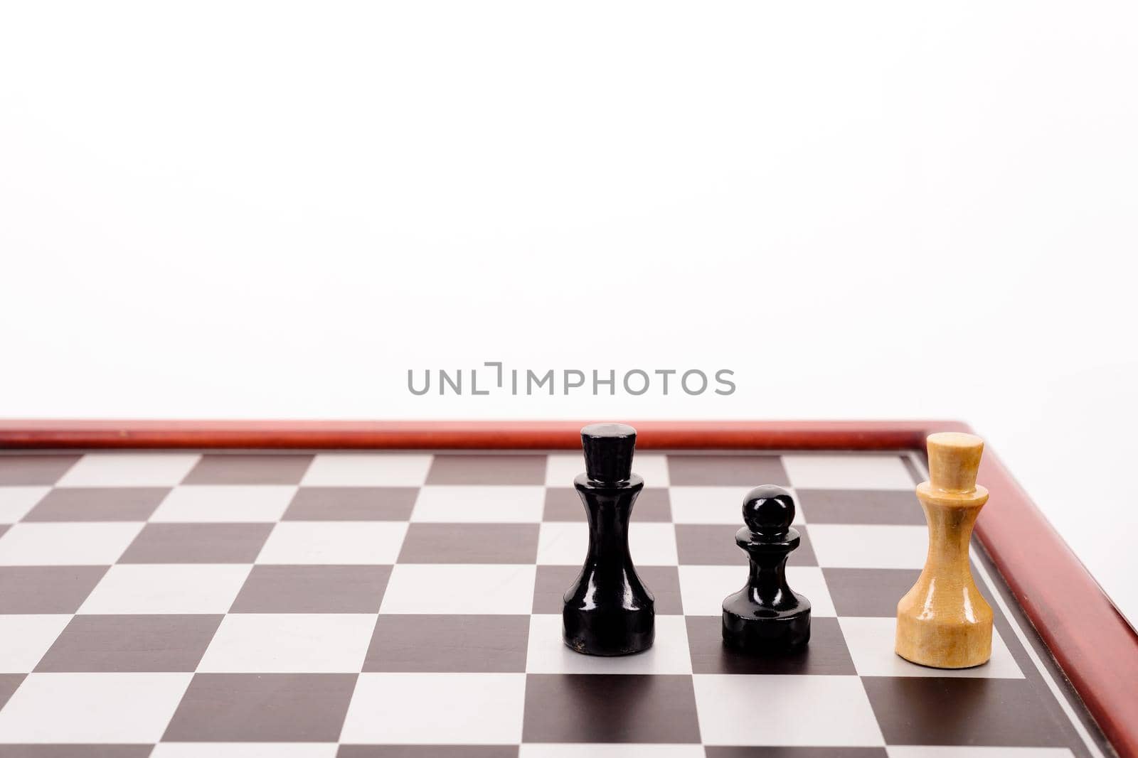 old chessboard and three figures on a white background.
