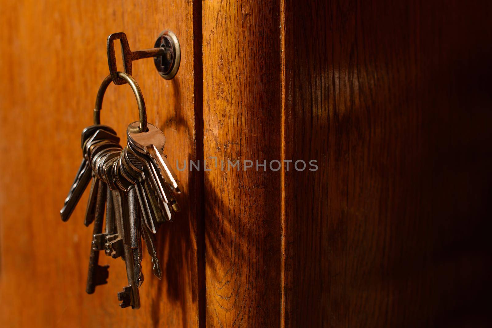 keys in the lock of a old door concept