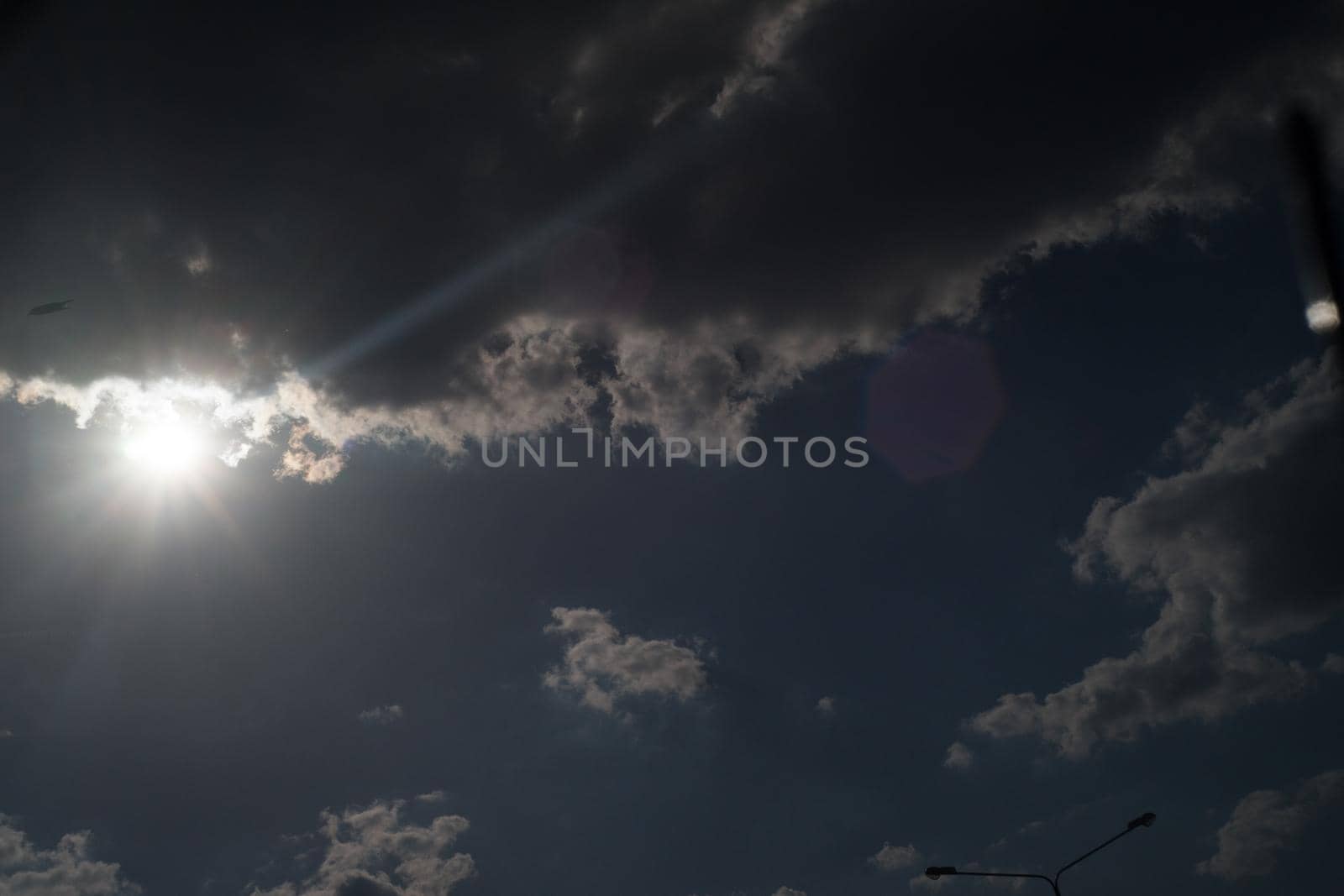 The sun shines bright in summer. Blue sky and clouds.- image