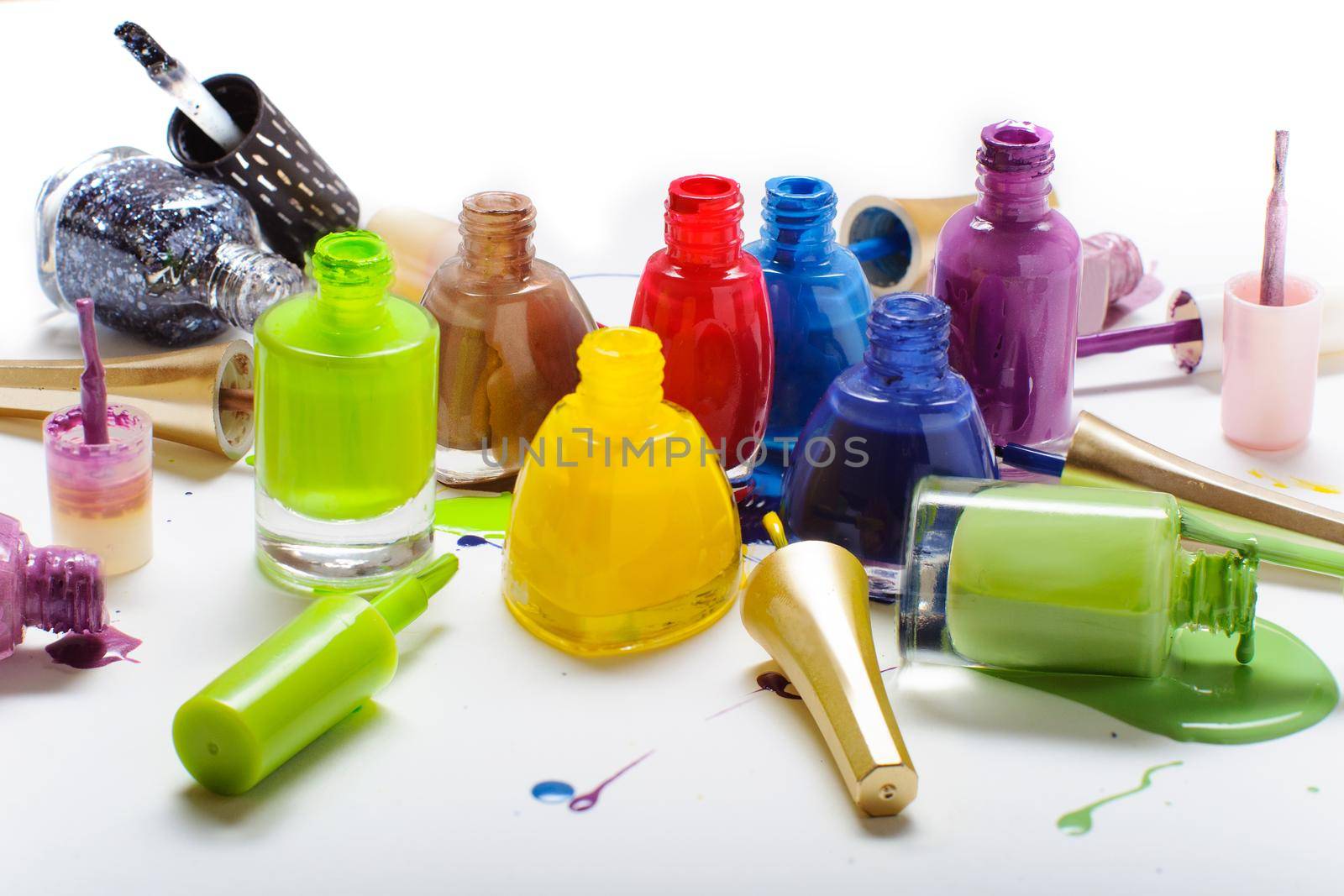 Colorful nail polish isolated on white background.