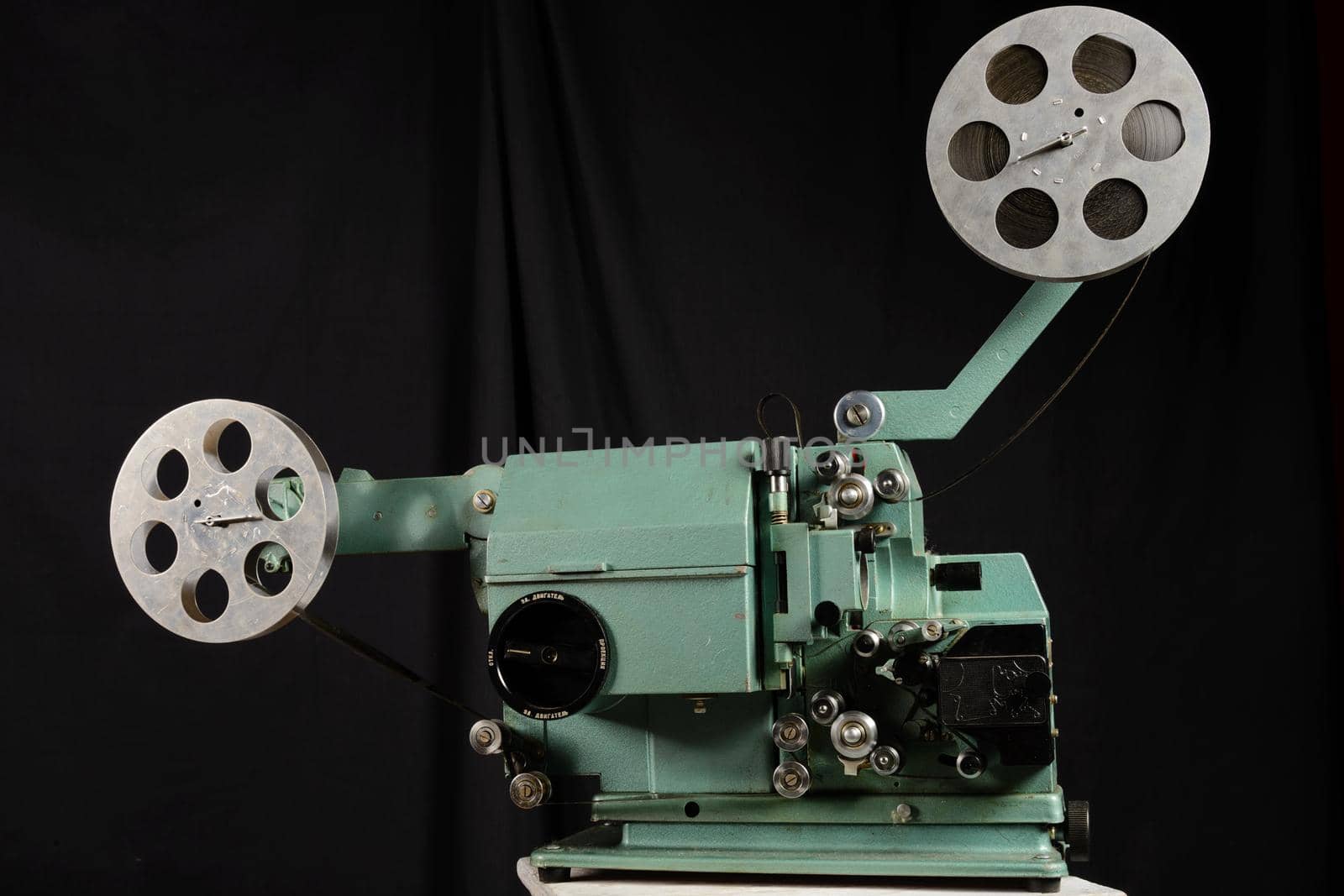 Old film projector on a white background