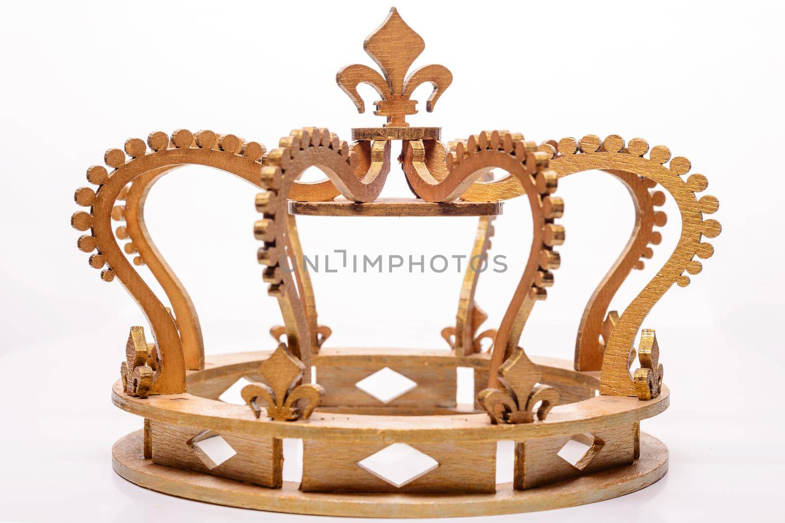 close-up of golden royal crown on white background.