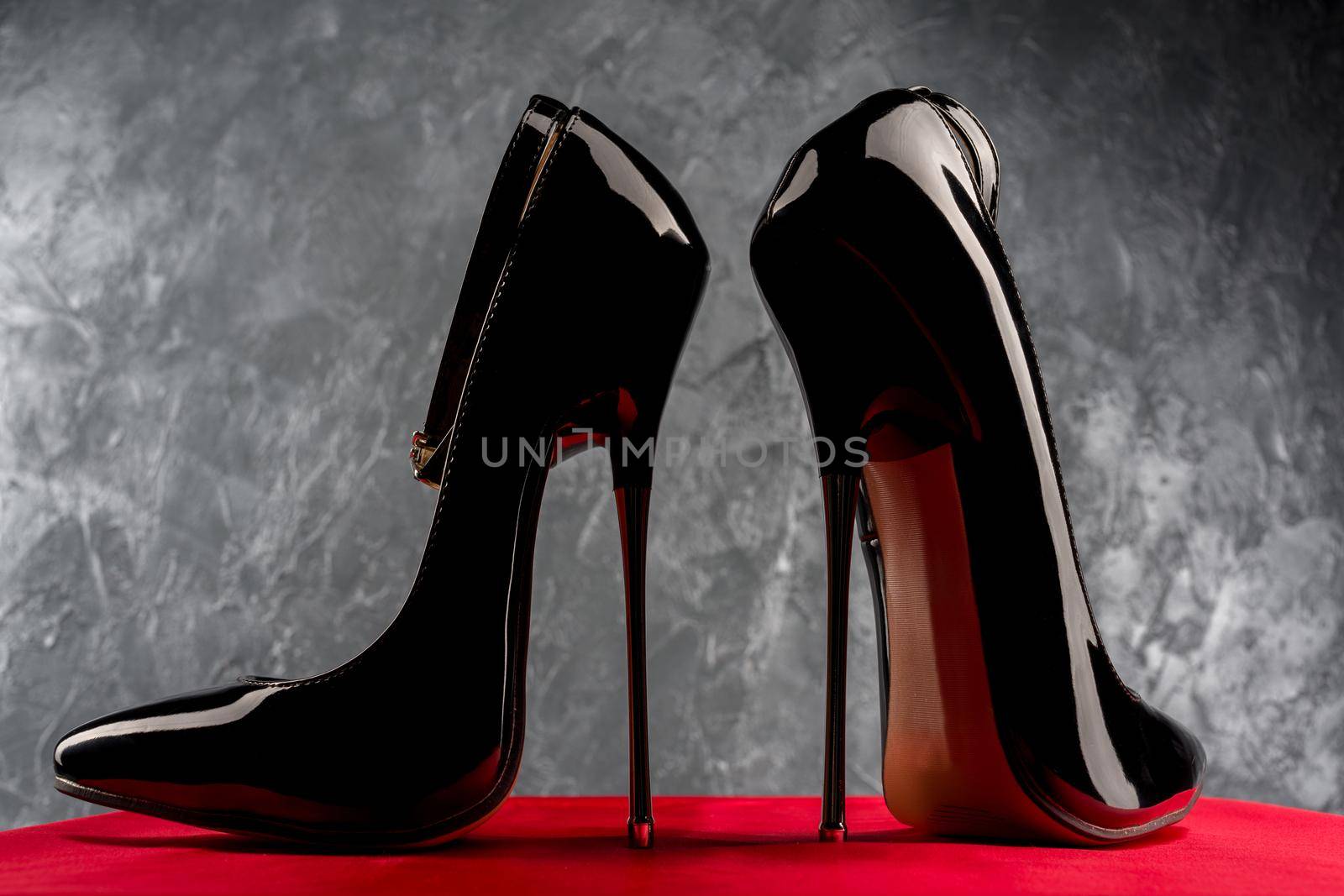 Black fetish shiny patent leather stiletto high heels with ankle strap - image