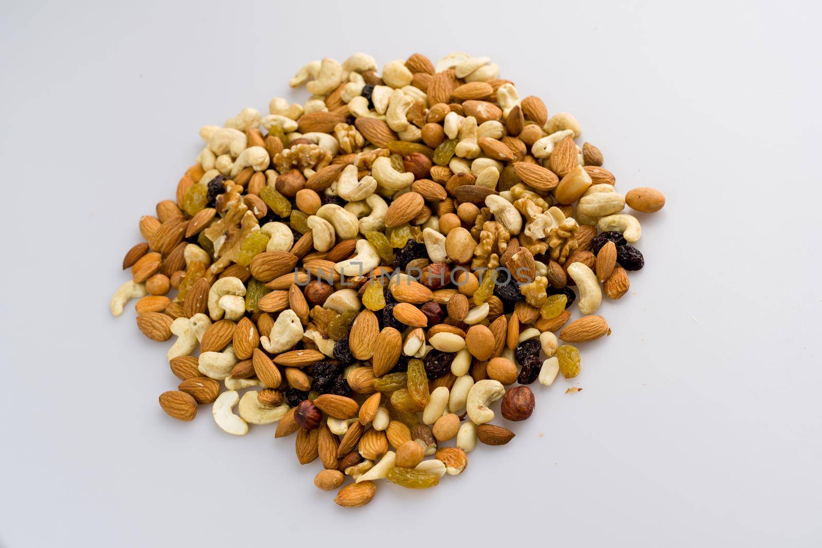 Mix of nuts and dried fruits. Cashew, almonds, macadamia, hazelnuts, Brazilian, walnuts, raisins, peanuts - image