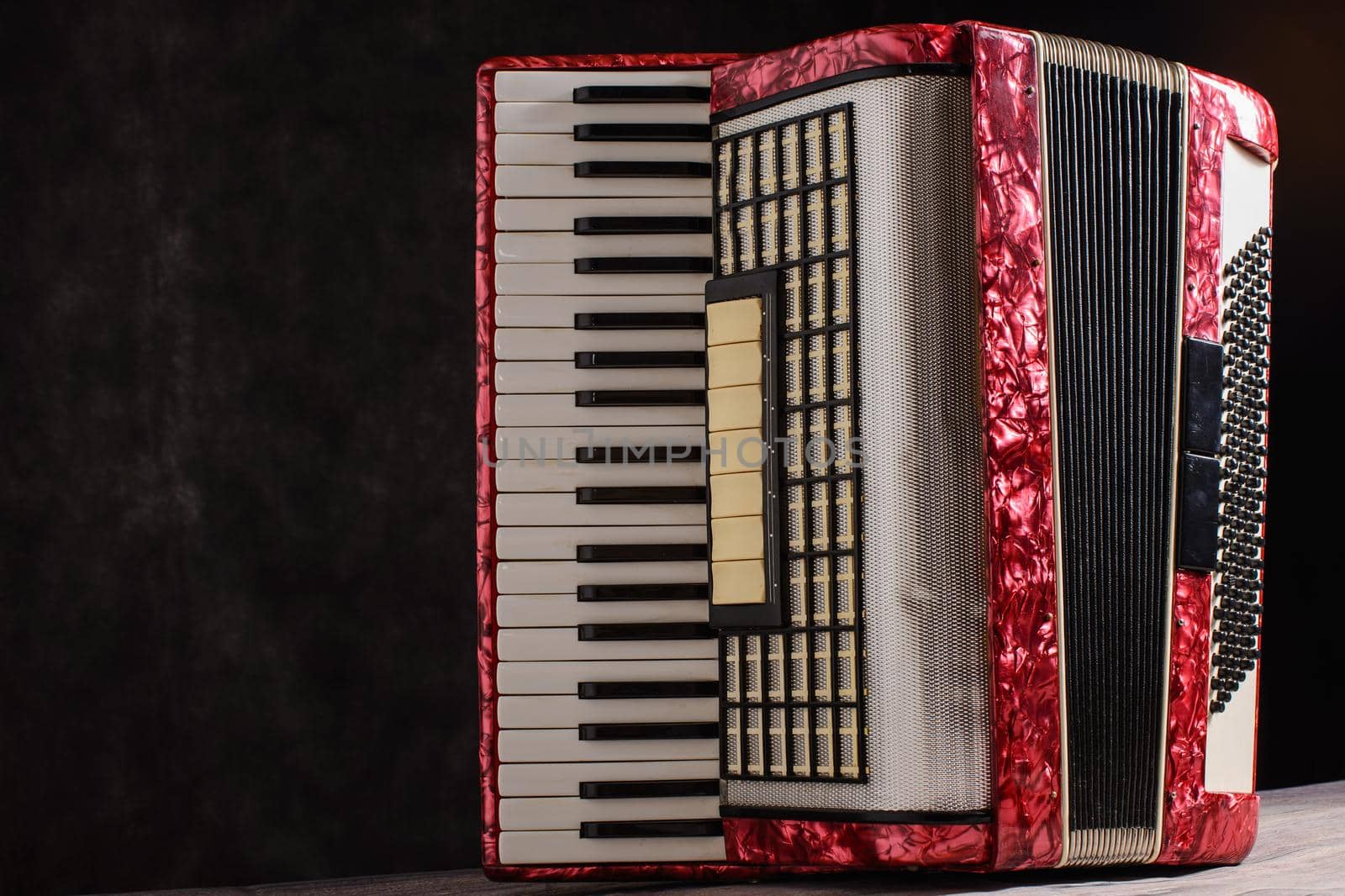Mother of pearl accordion on a black background.