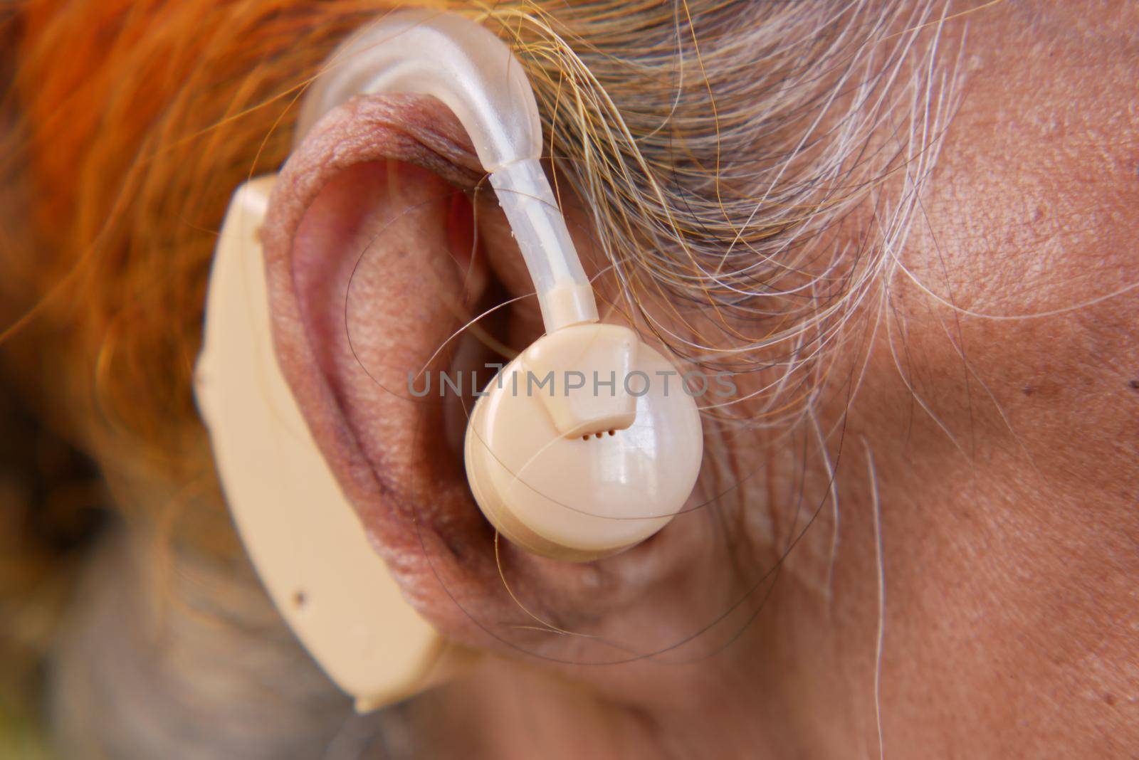 Hearing aid concept, a senior women with hearing problems