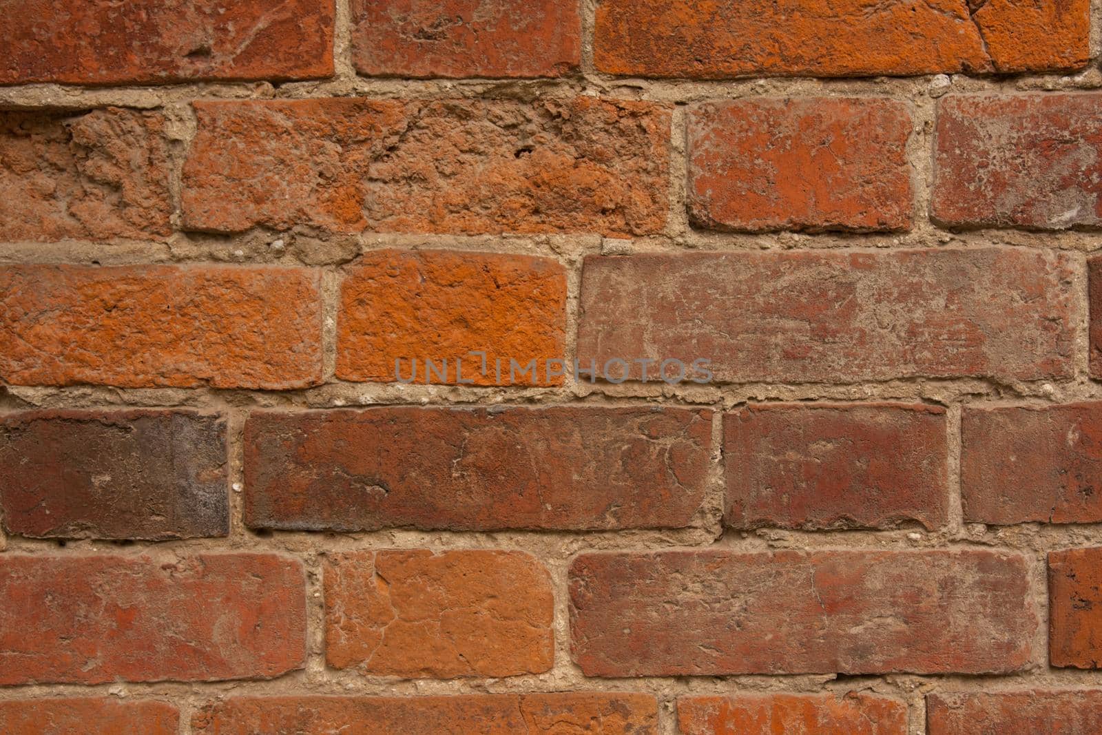 red brick wall texture grunge background with vignetted corners, may use to interior design.
