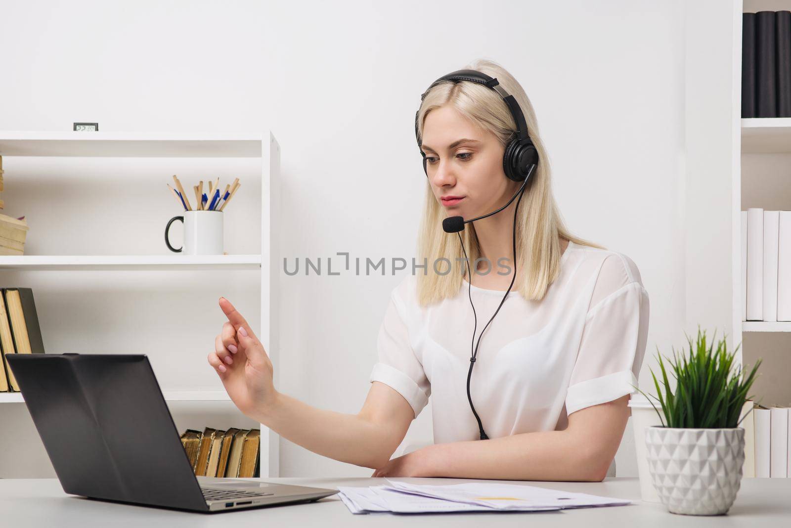 Close-up portrait of a customer service agent sitting at office by zartarn