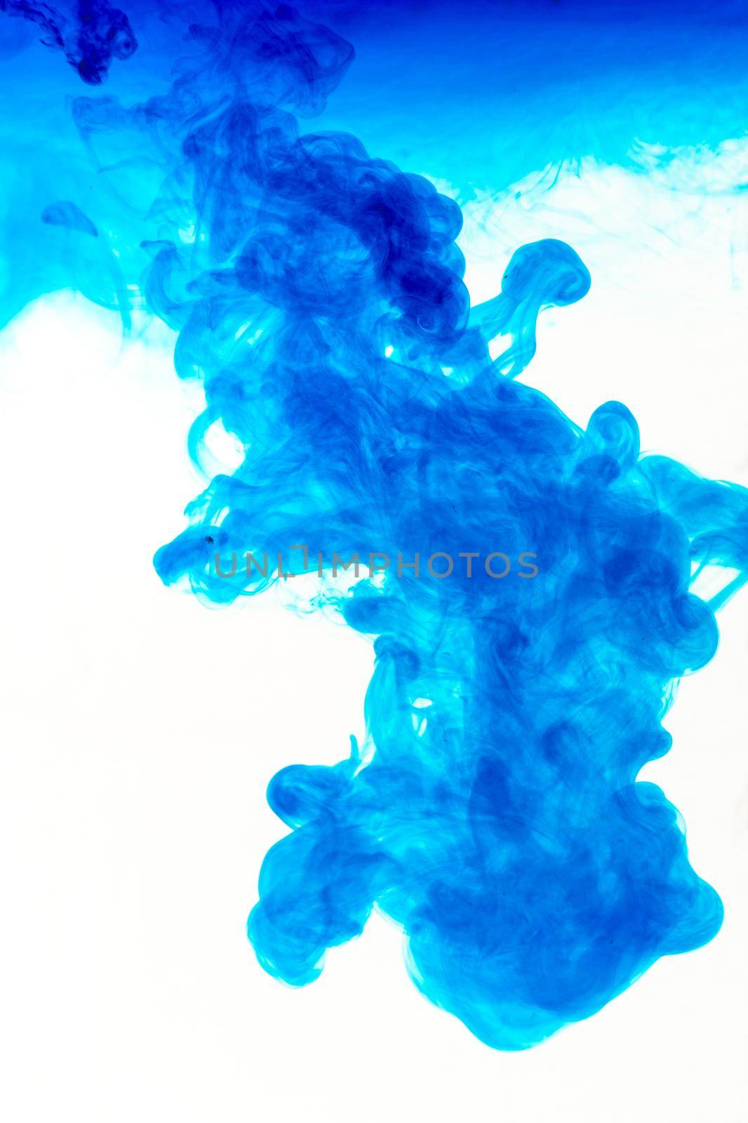 Cloud of ink in water isolated on white. Color of the year 2020. - image