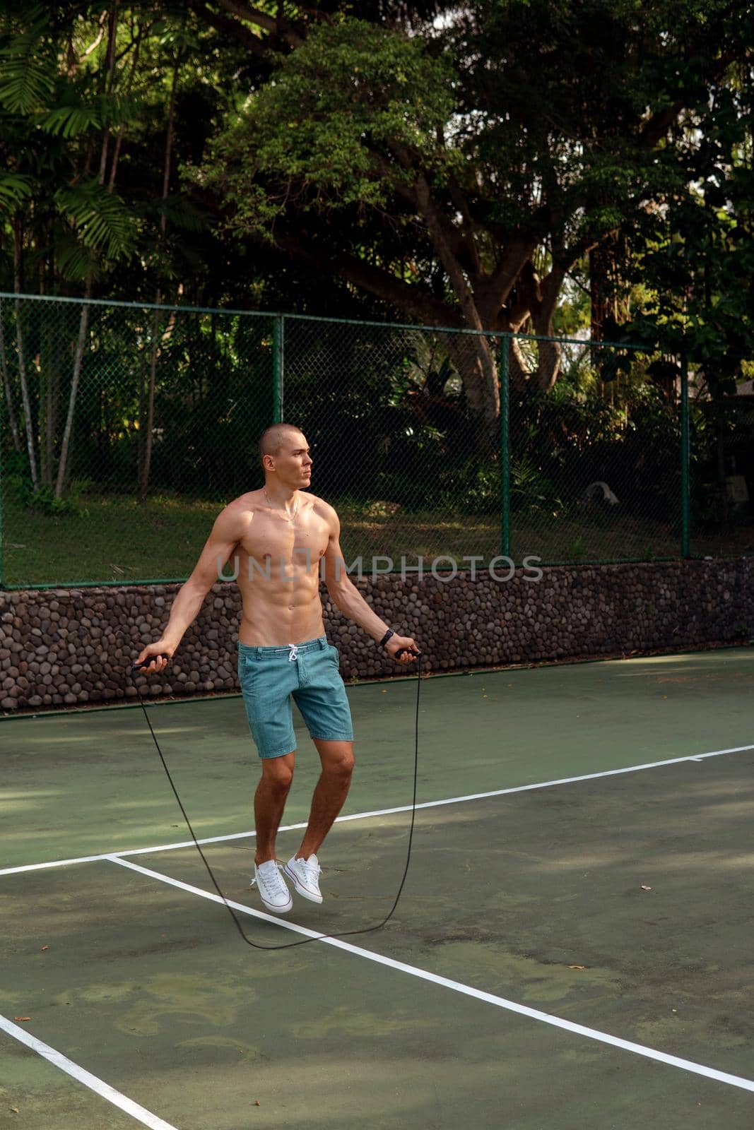 a man doing with rubber bands by Alexzhilkin