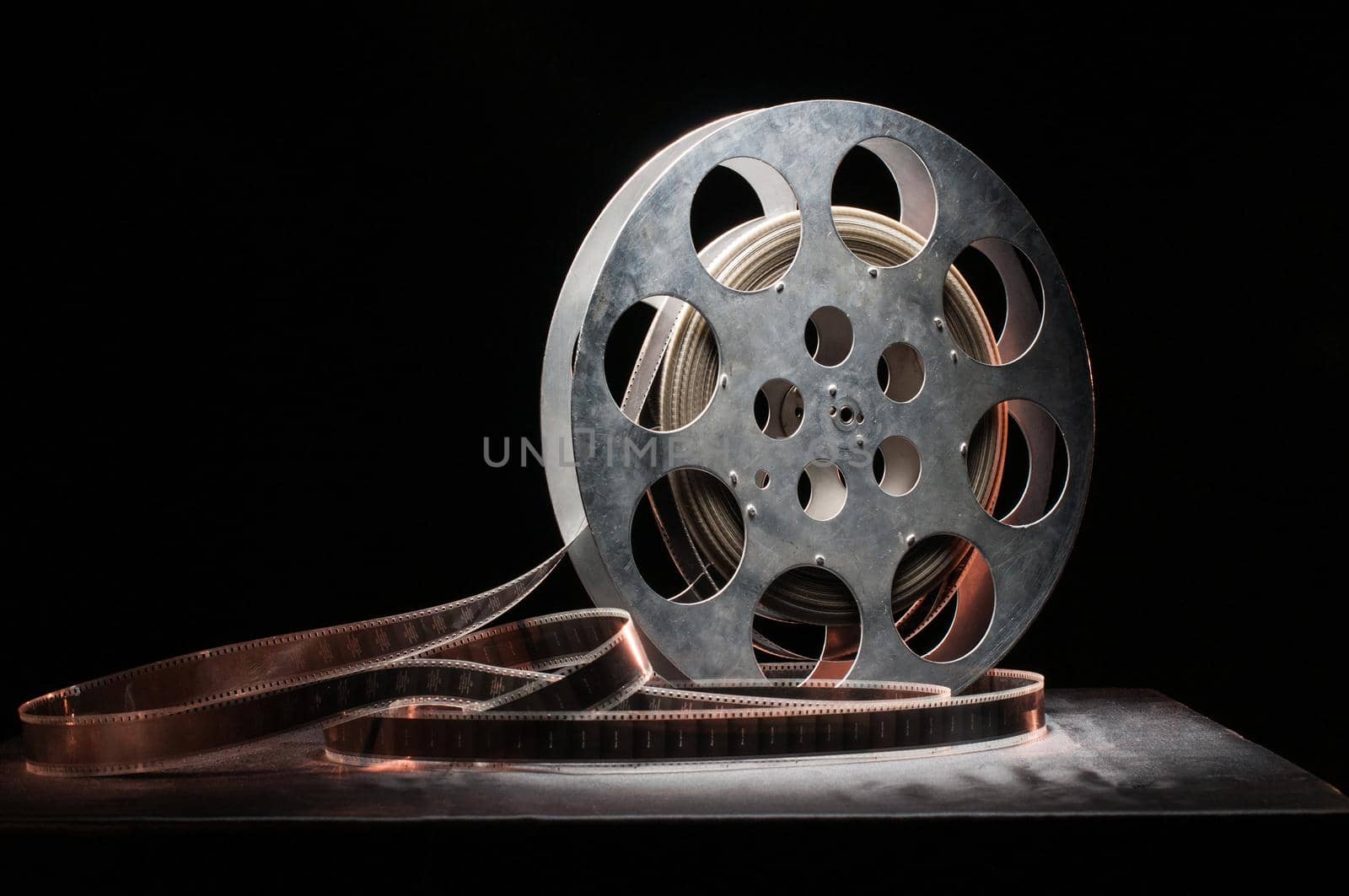 Movie reel on a wooden background