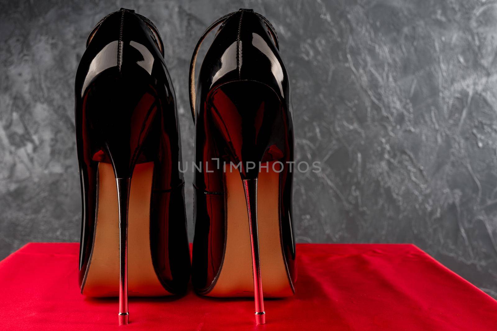 Black fetish shiny patent leather stiletto high heels with ankle strap - image