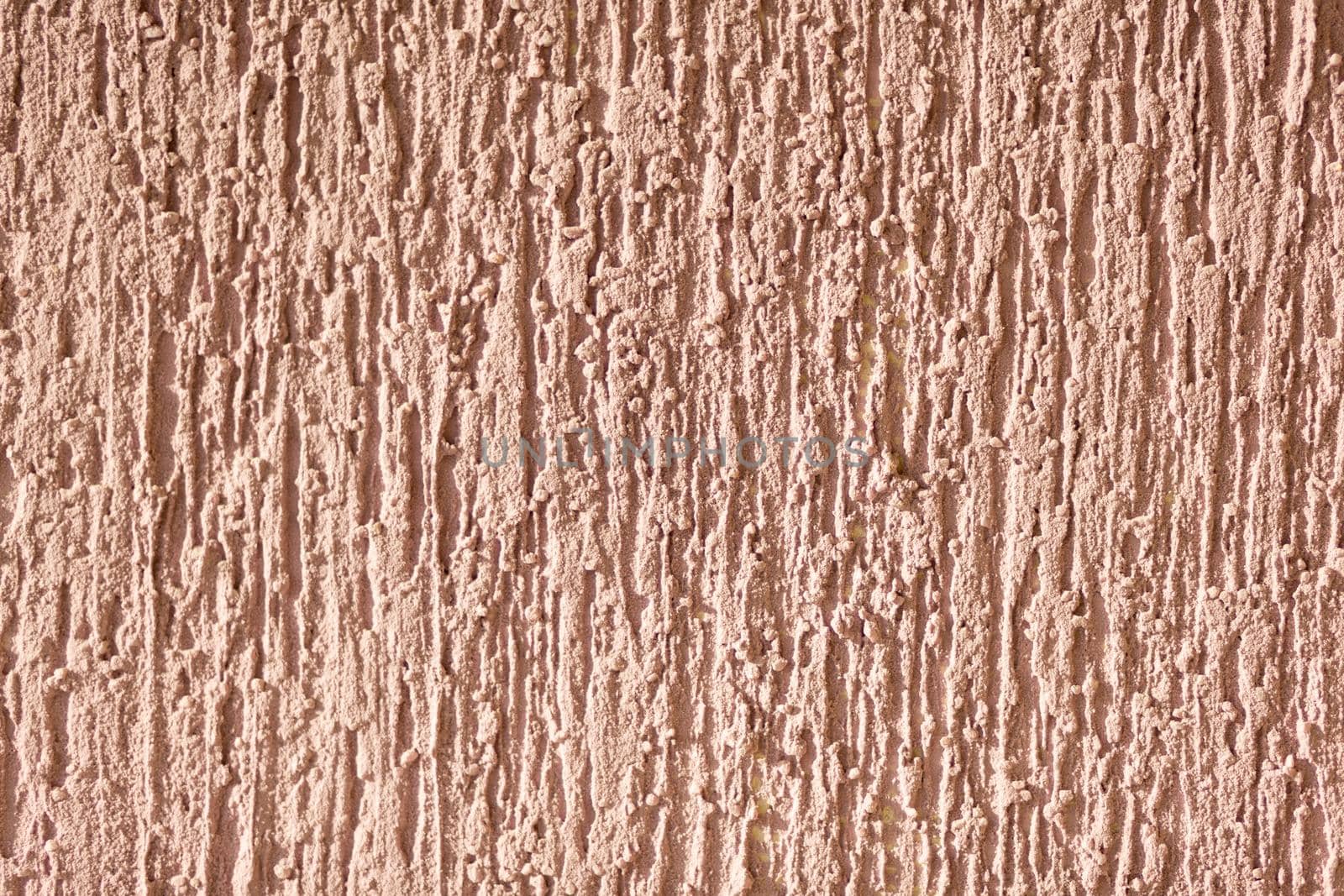brown background facade plaster. Exterior building structure backdrop. Silica sand cement wall.