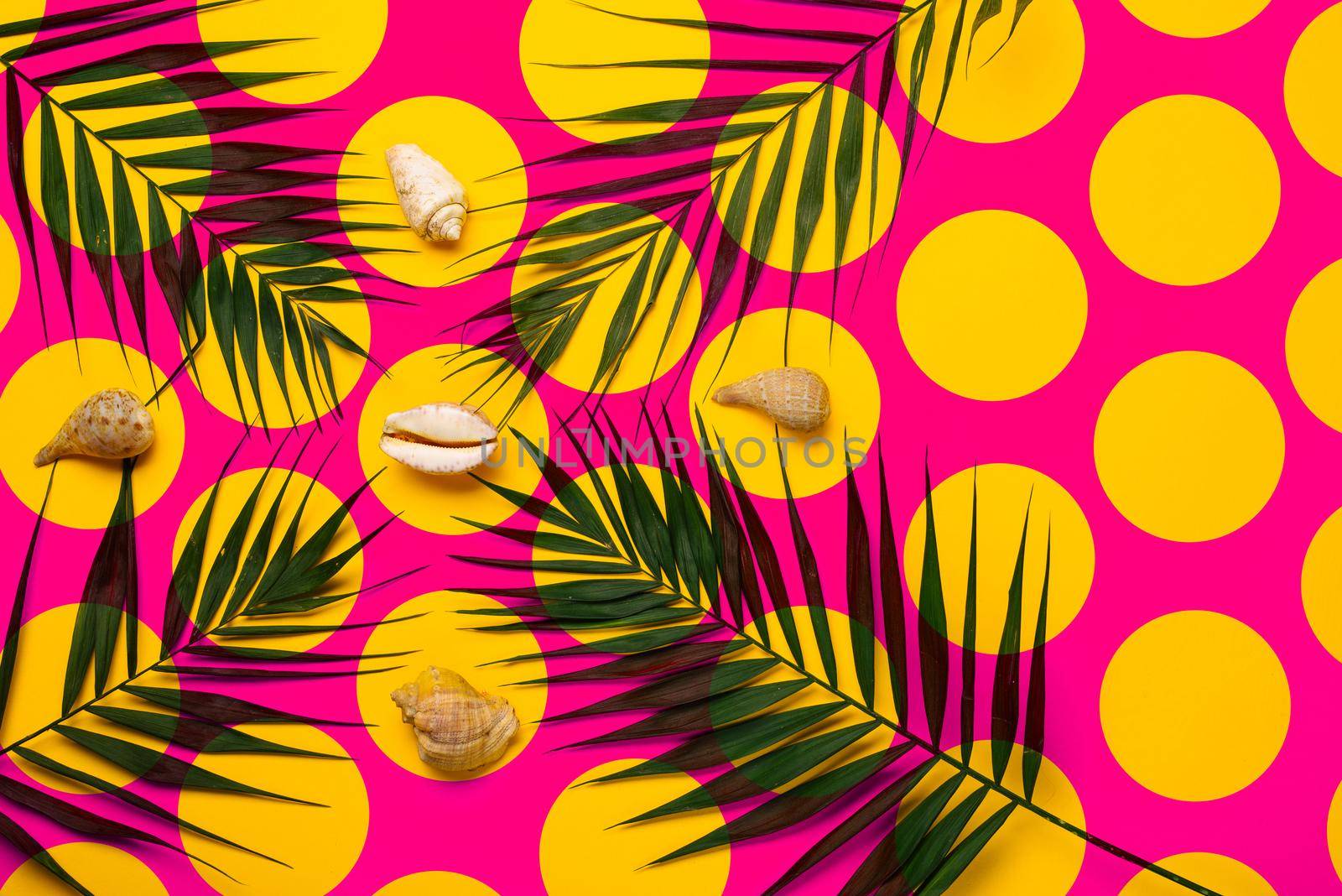 Flat lay traveler accessories with palm leaf, seashells . Top view travel or vacation concept. Summer background.