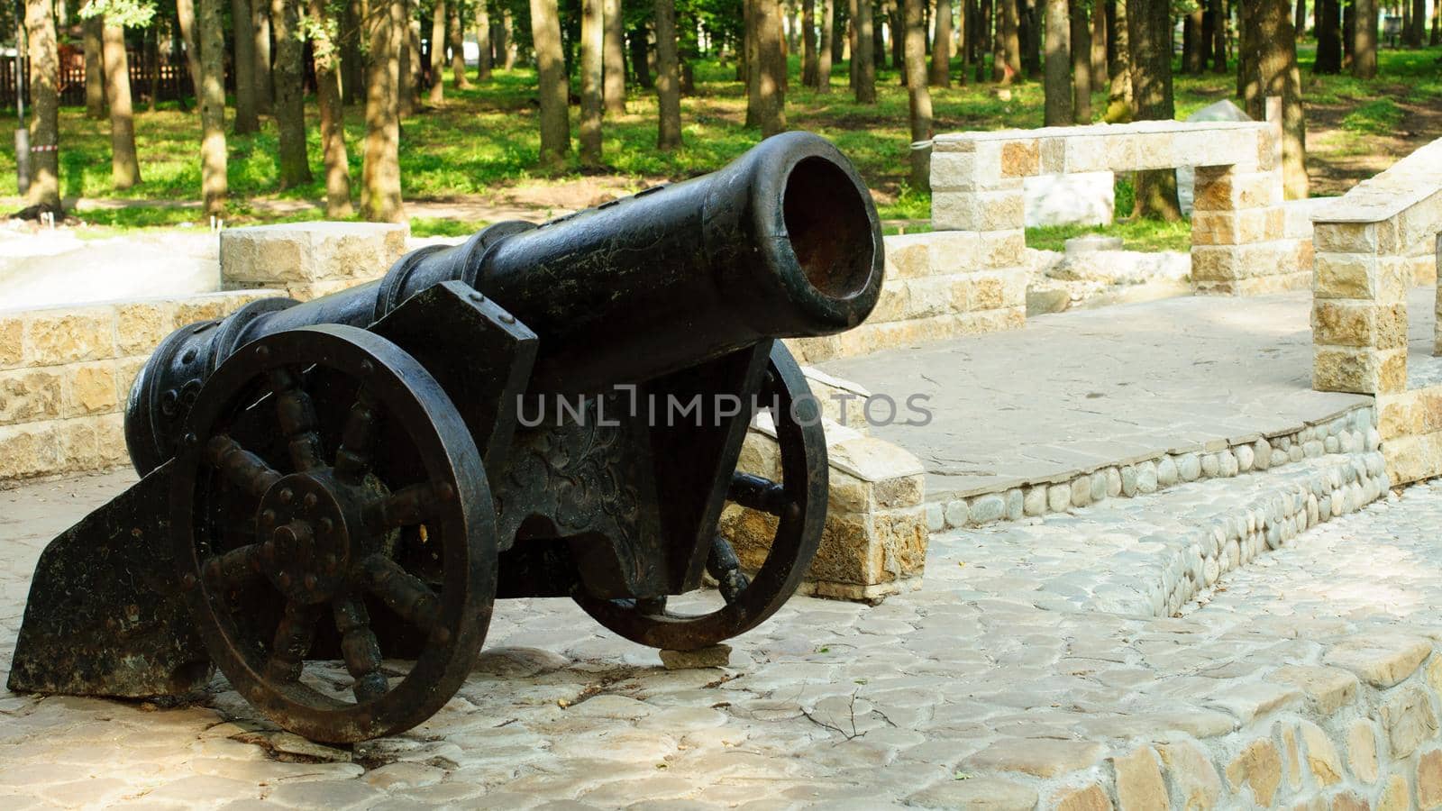 antique cast iron metal cannon at the pier.summer