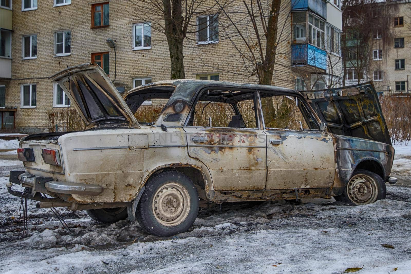 urnt out car near the apartment building. hdr Photo.