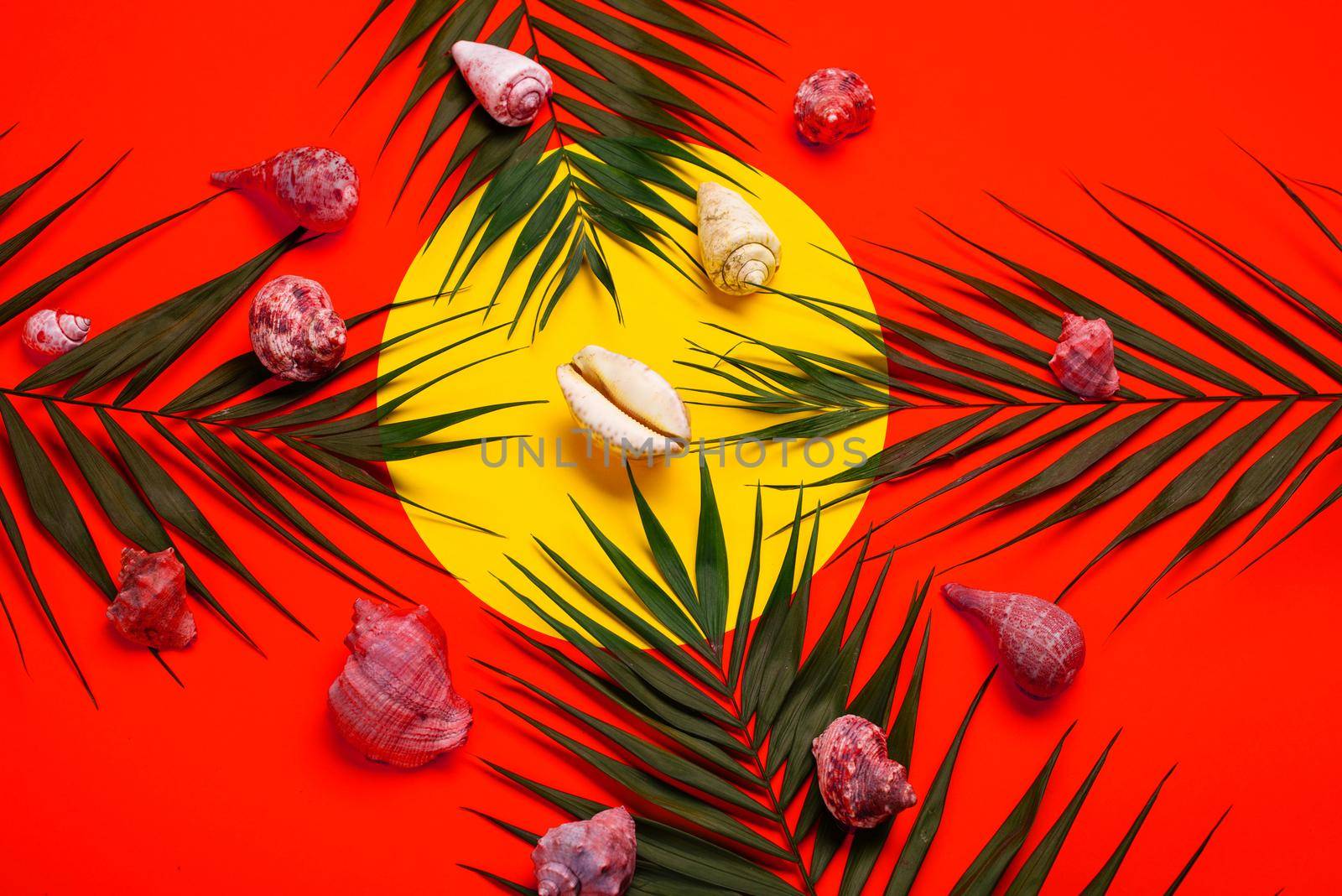 Flat lay traveler accessories with palm leaf, seashells . Top view travel or vacation concept. Summer background.