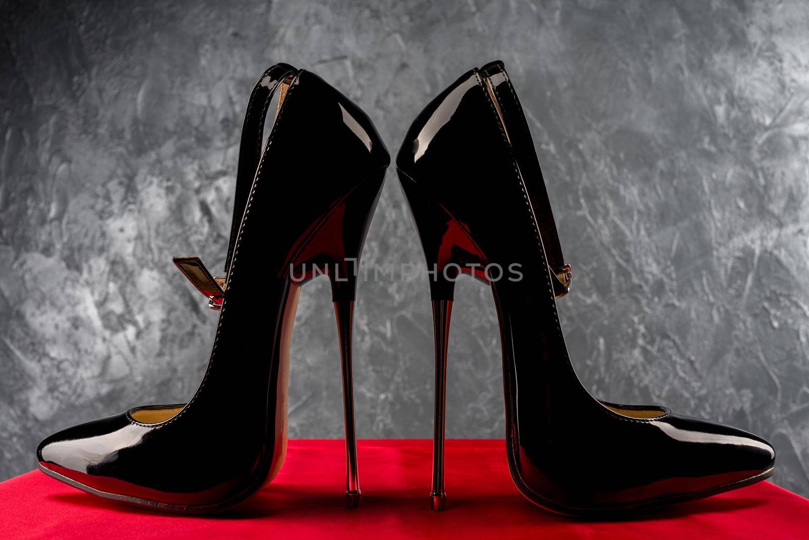 Black fetish shiny patent leather stiletto high heels with ankle strap - image