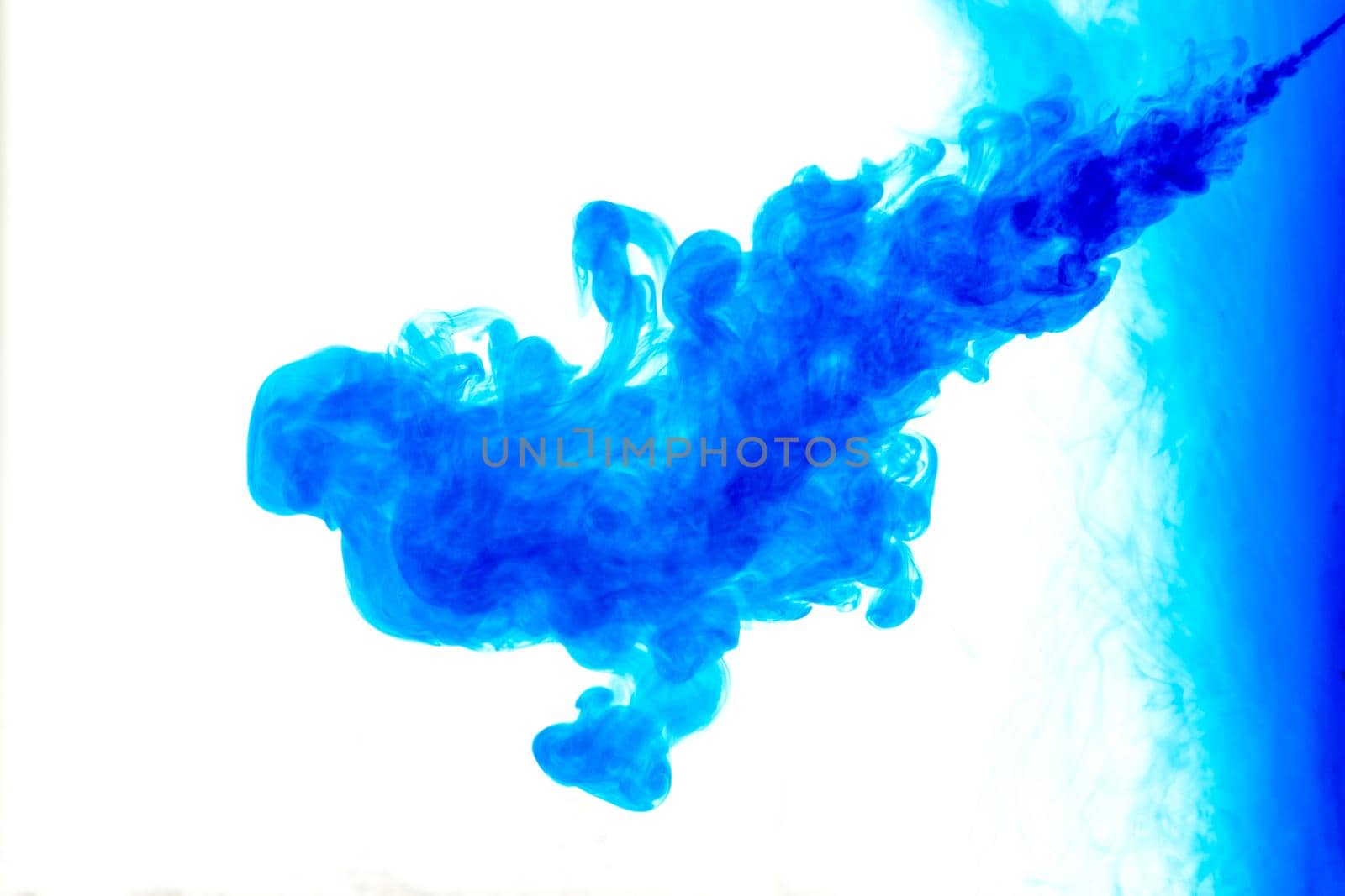 Cloud of ink in water isolated on white. Color of the year 2020. - image
