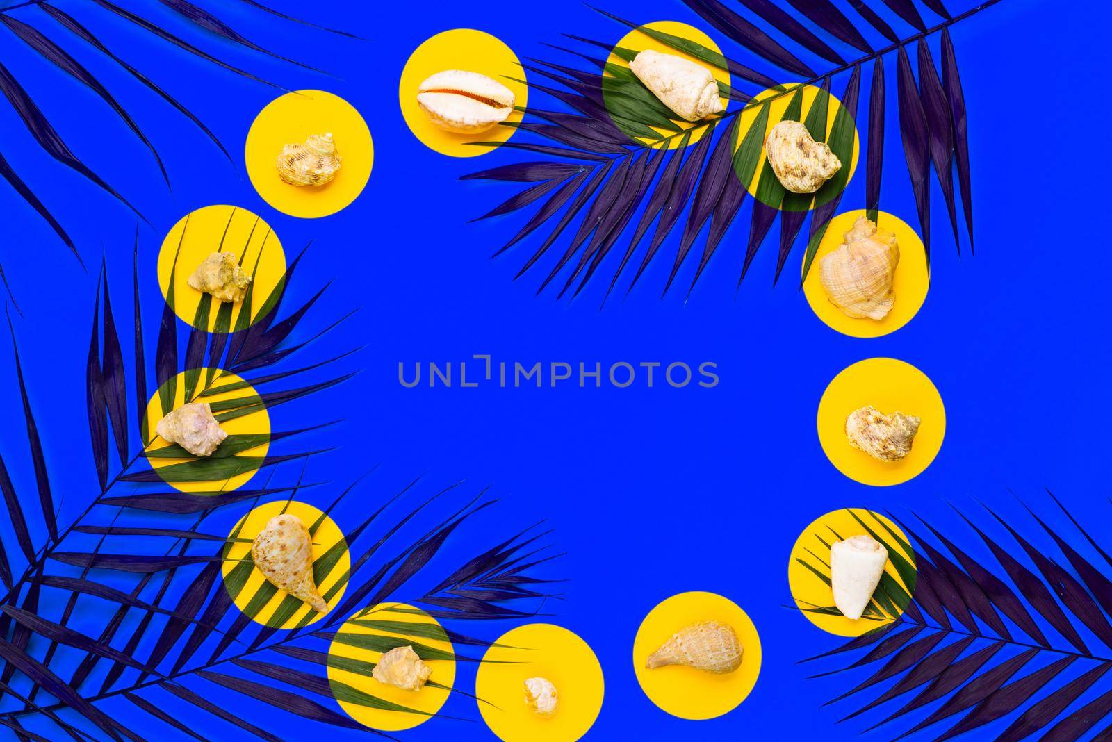 Flat lay traveler accessories with palm leaf, seashells. Top view travel or vacation concept. Summer background.
