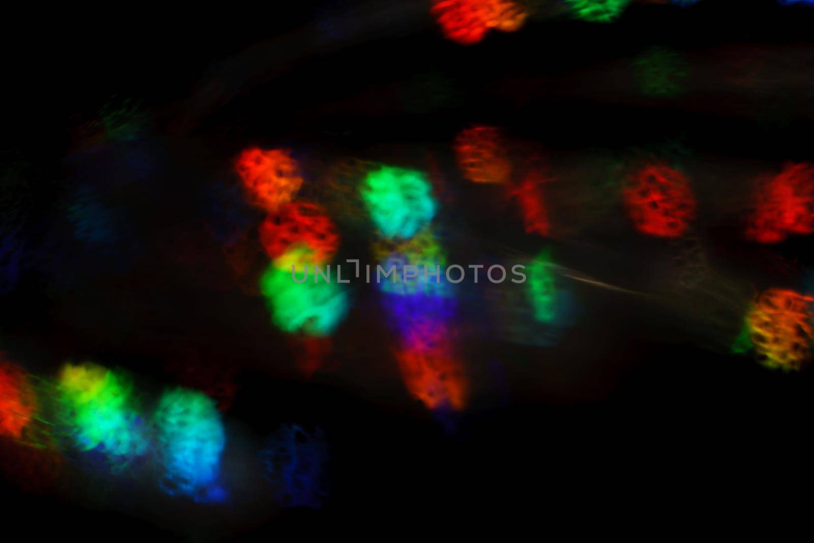 Christmas background. Festive abstract background with bokeh defocused lights and stars.